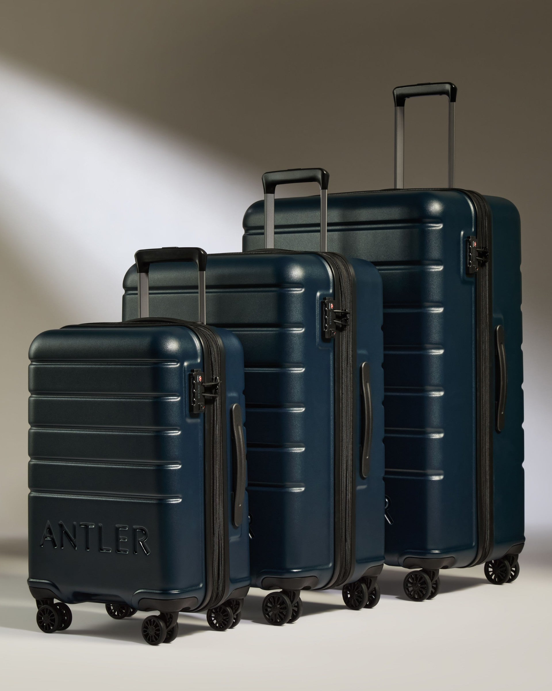 a group of luggage on wheels