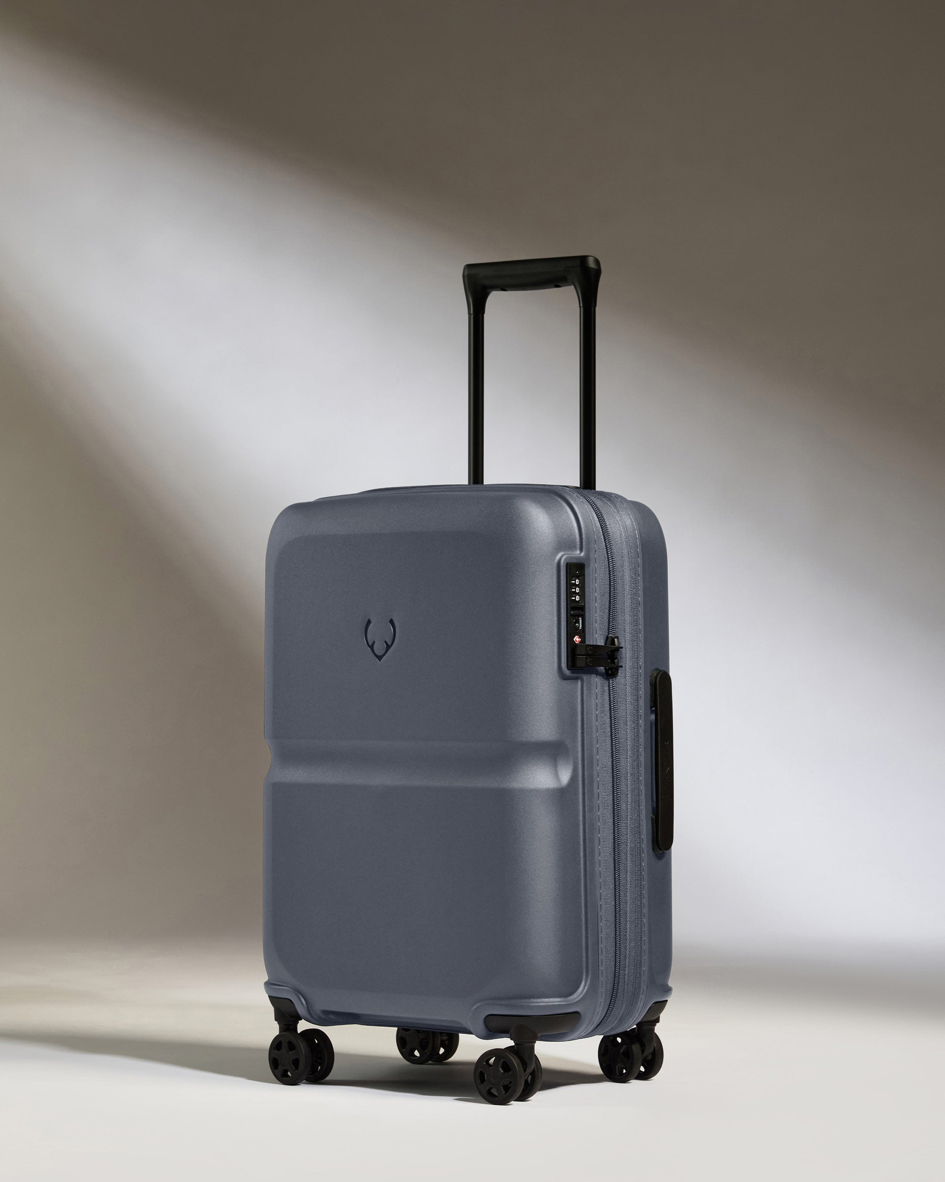 a grey suitcase with wheels