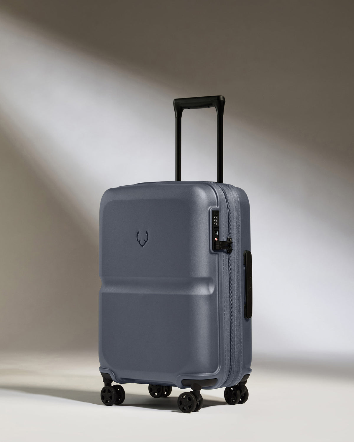 a grey suitcase with wheels