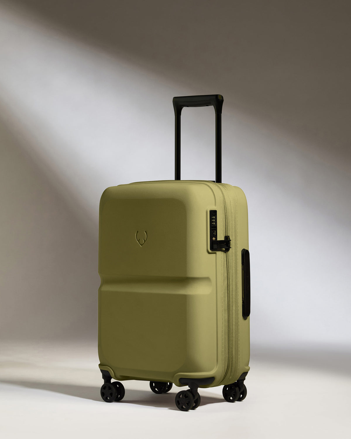a green suitcase with wheels