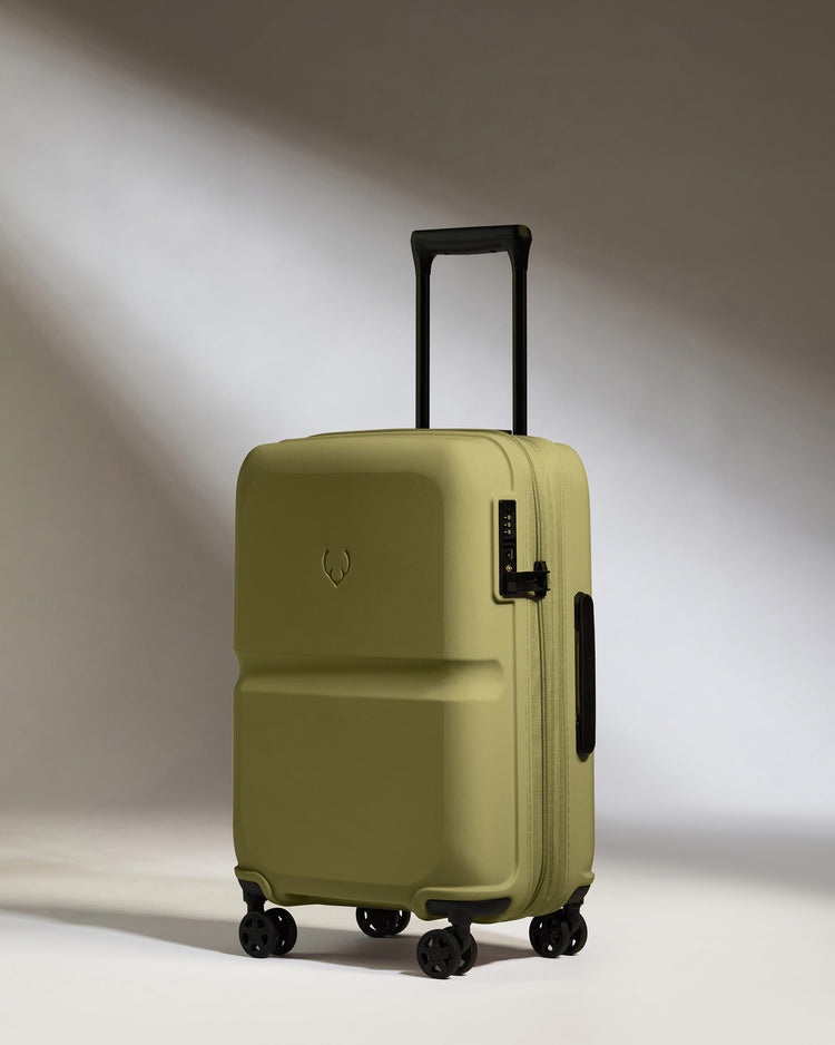 a green suitcase with wheels