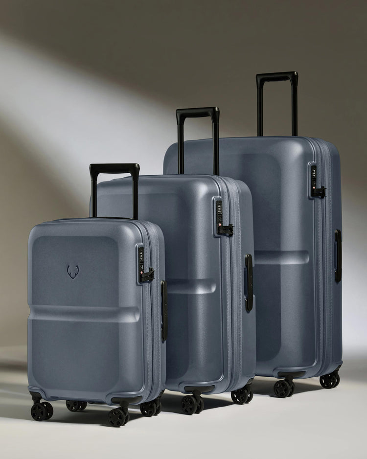 a group of luggage on wheels