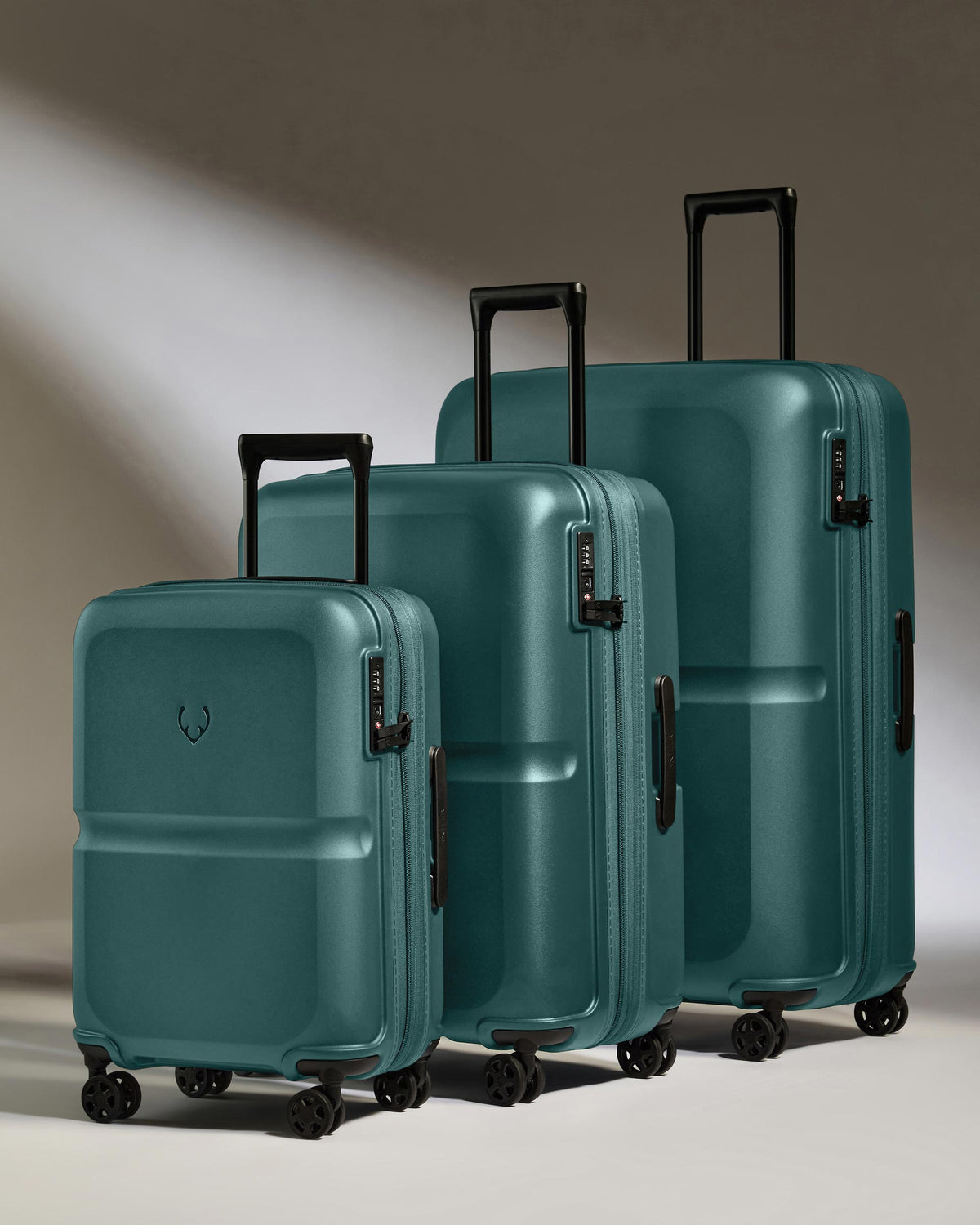 a group of luggage on wheels