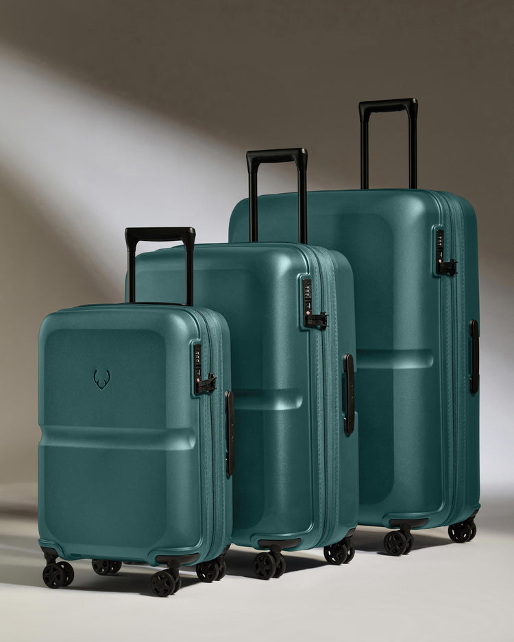 a group of luggage on wheels