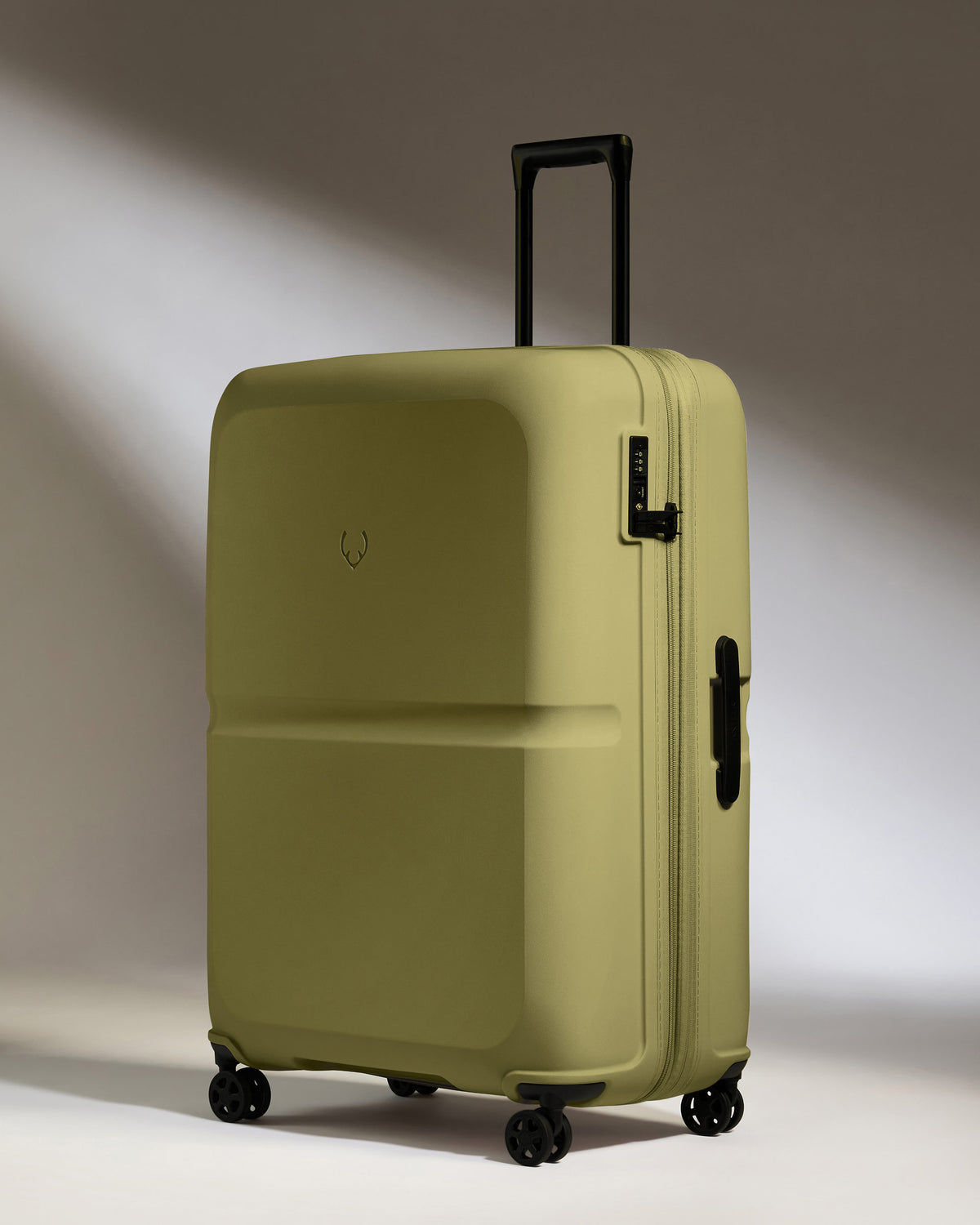 a green suitcase with wheels