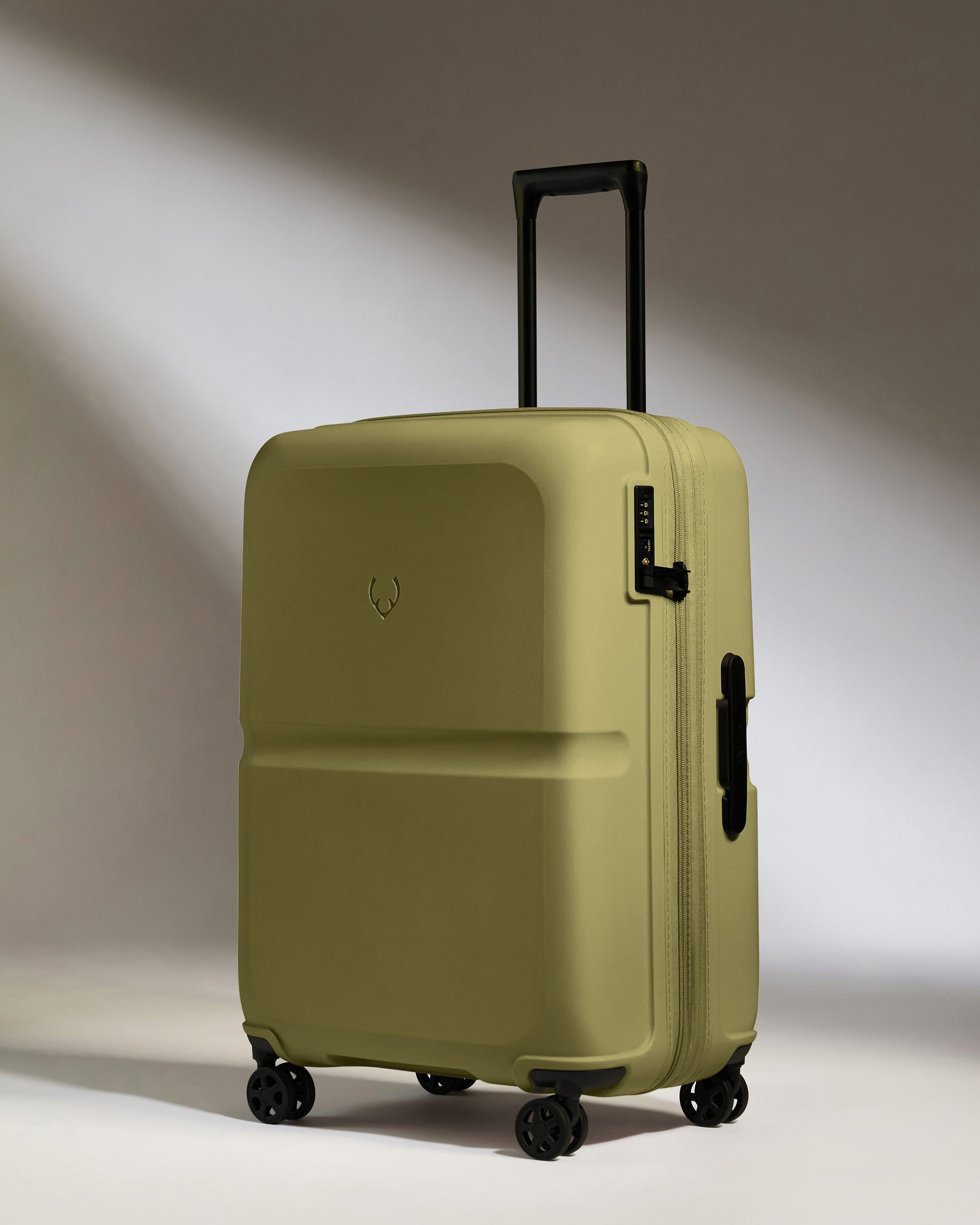 a green suitcase with wheels