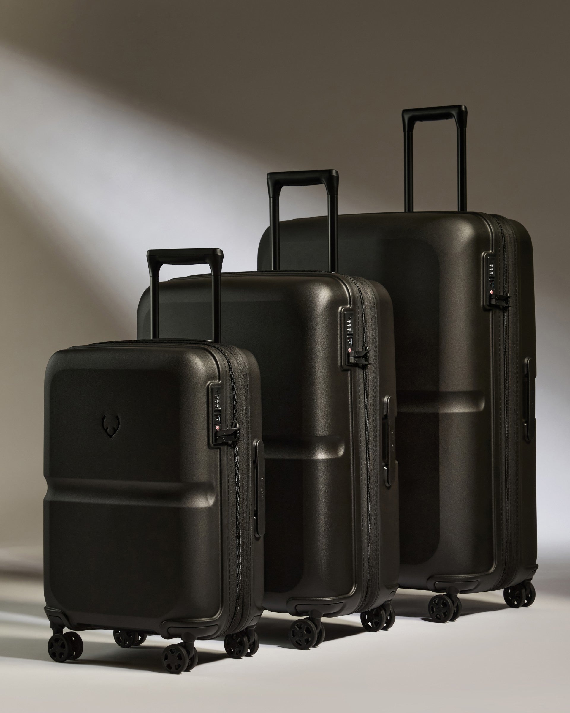 a group of black luggage