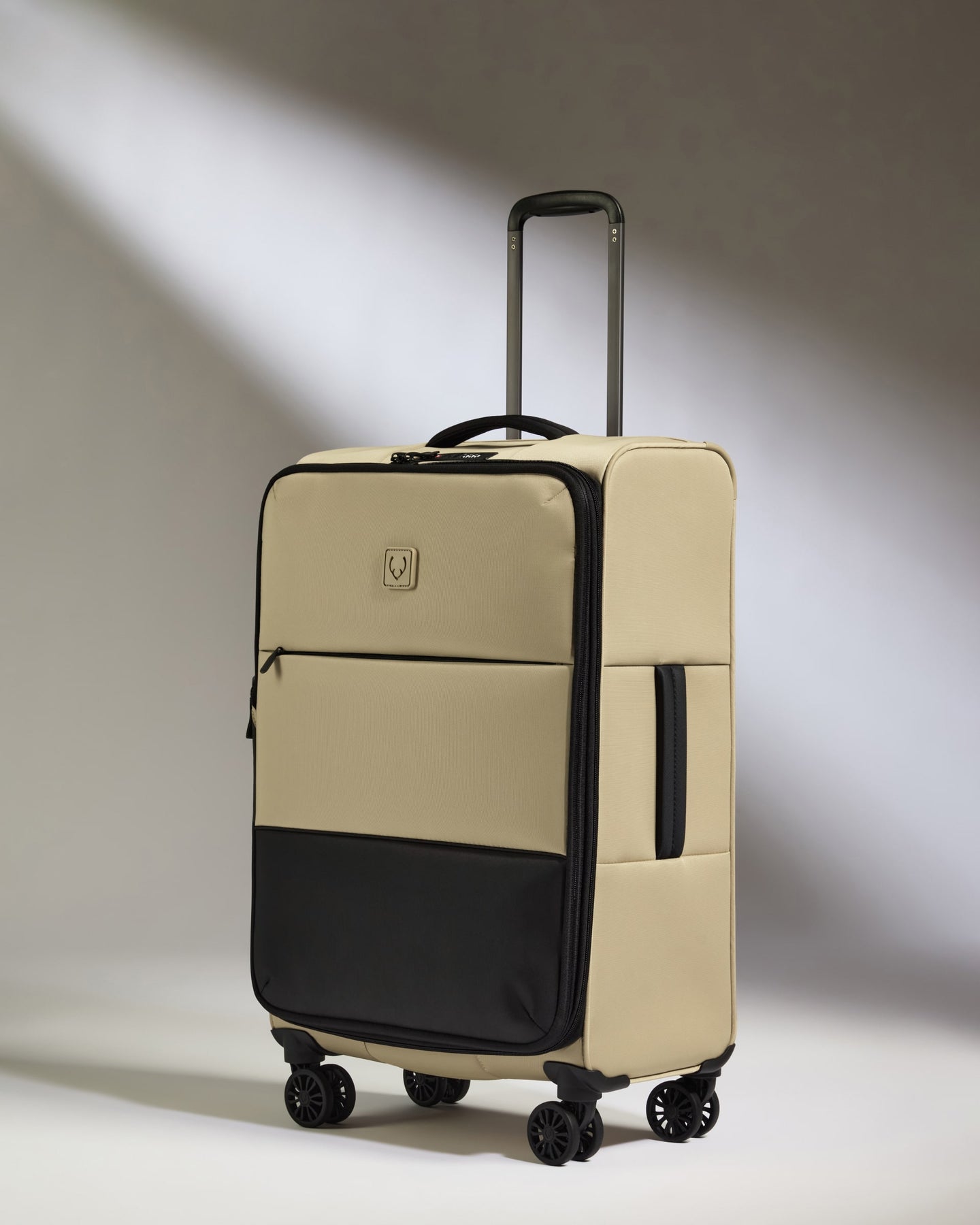 Lightest Medium Luggage in Sand - Soft Stripe 2.0