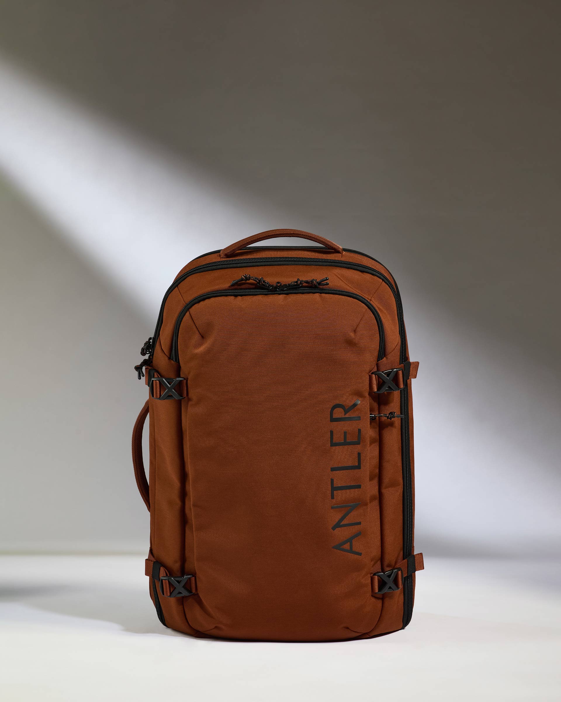 a brown backpack with black straps
