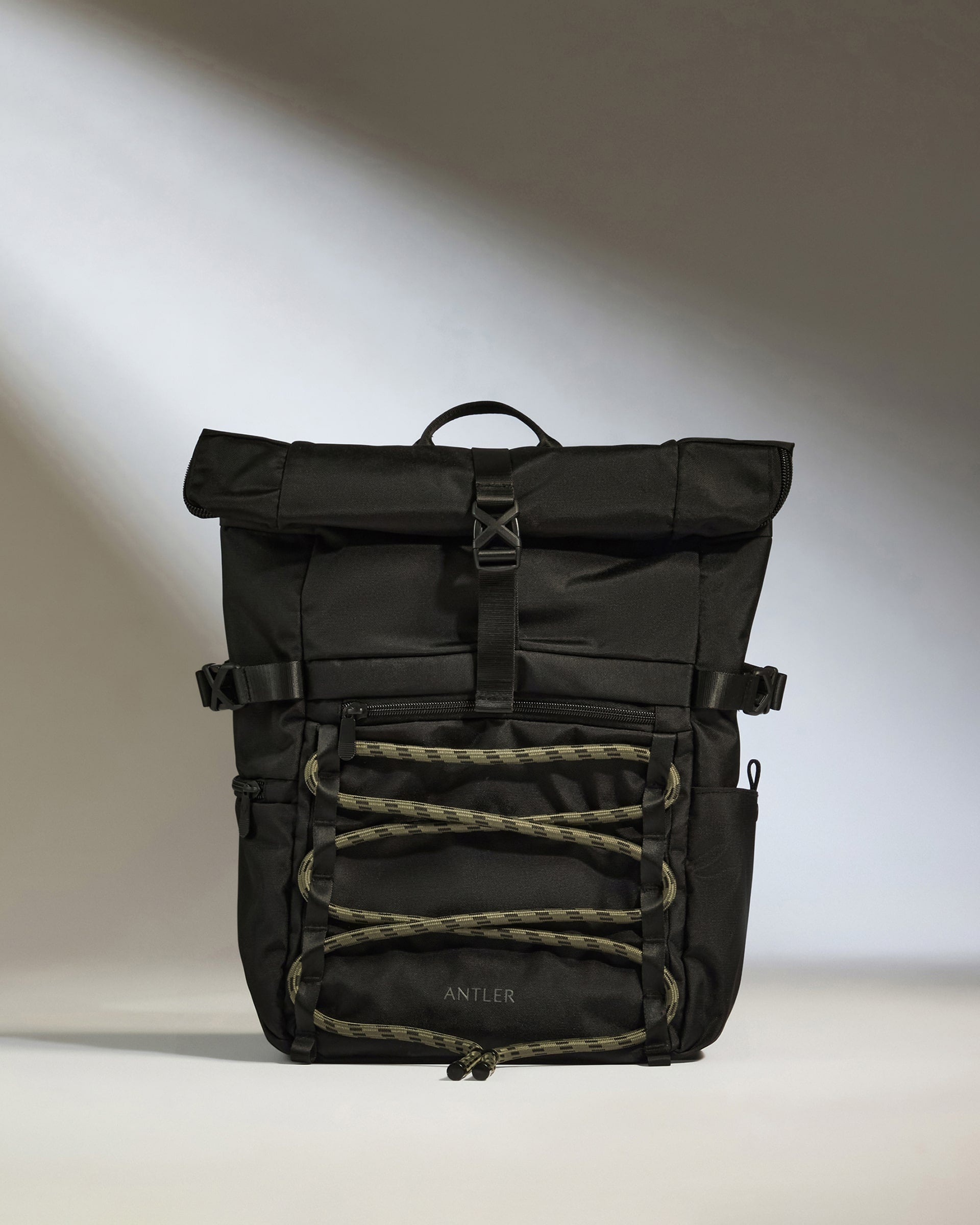 a black backpack with a strap
