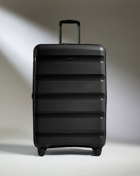 Large Luggage in Black - Logo Stripe