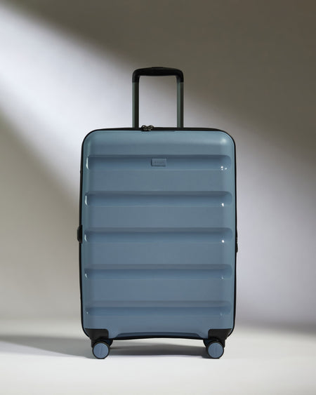 Medium Luggage in Light Blue - Logo Stripe