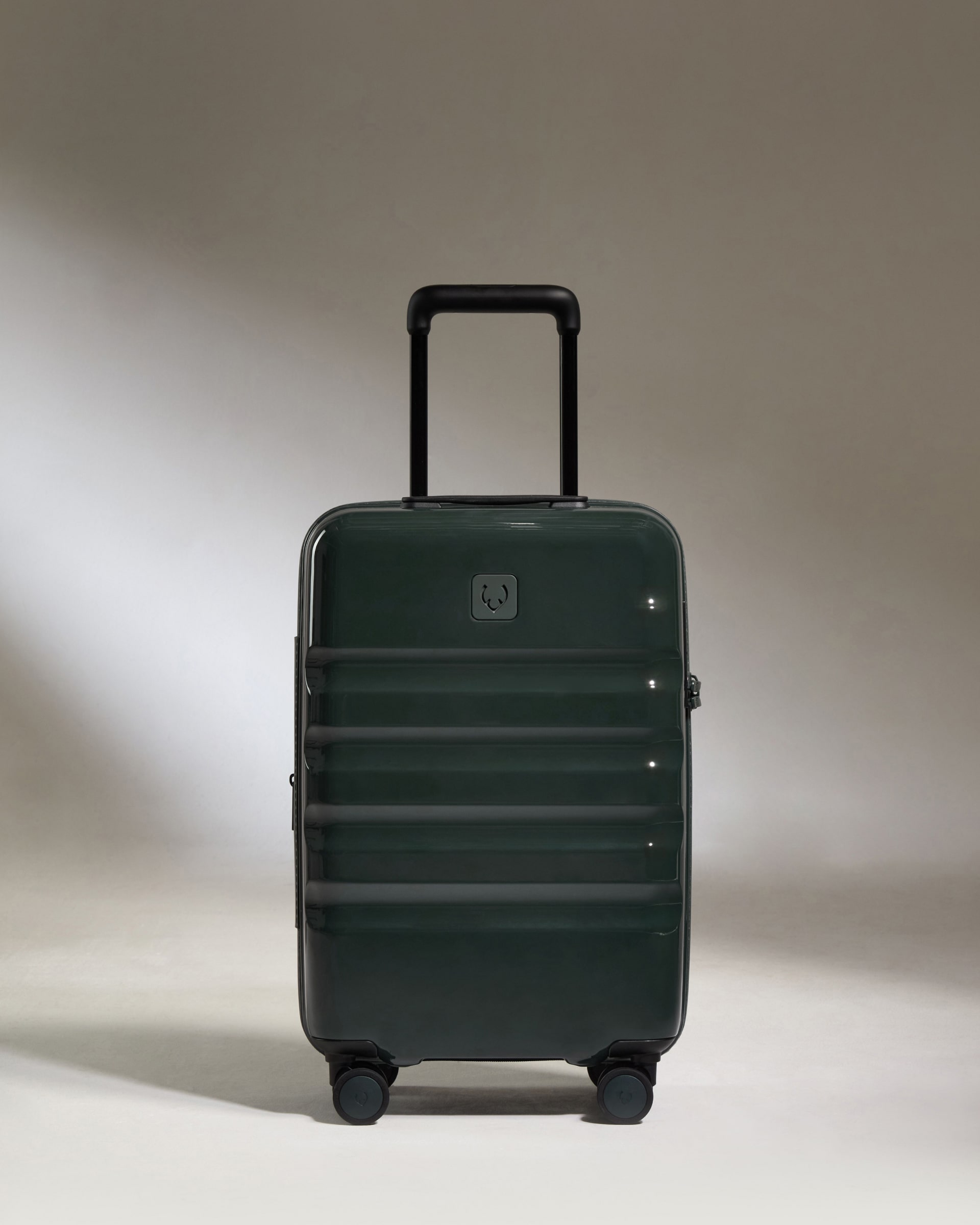 a green suitcase with wheels