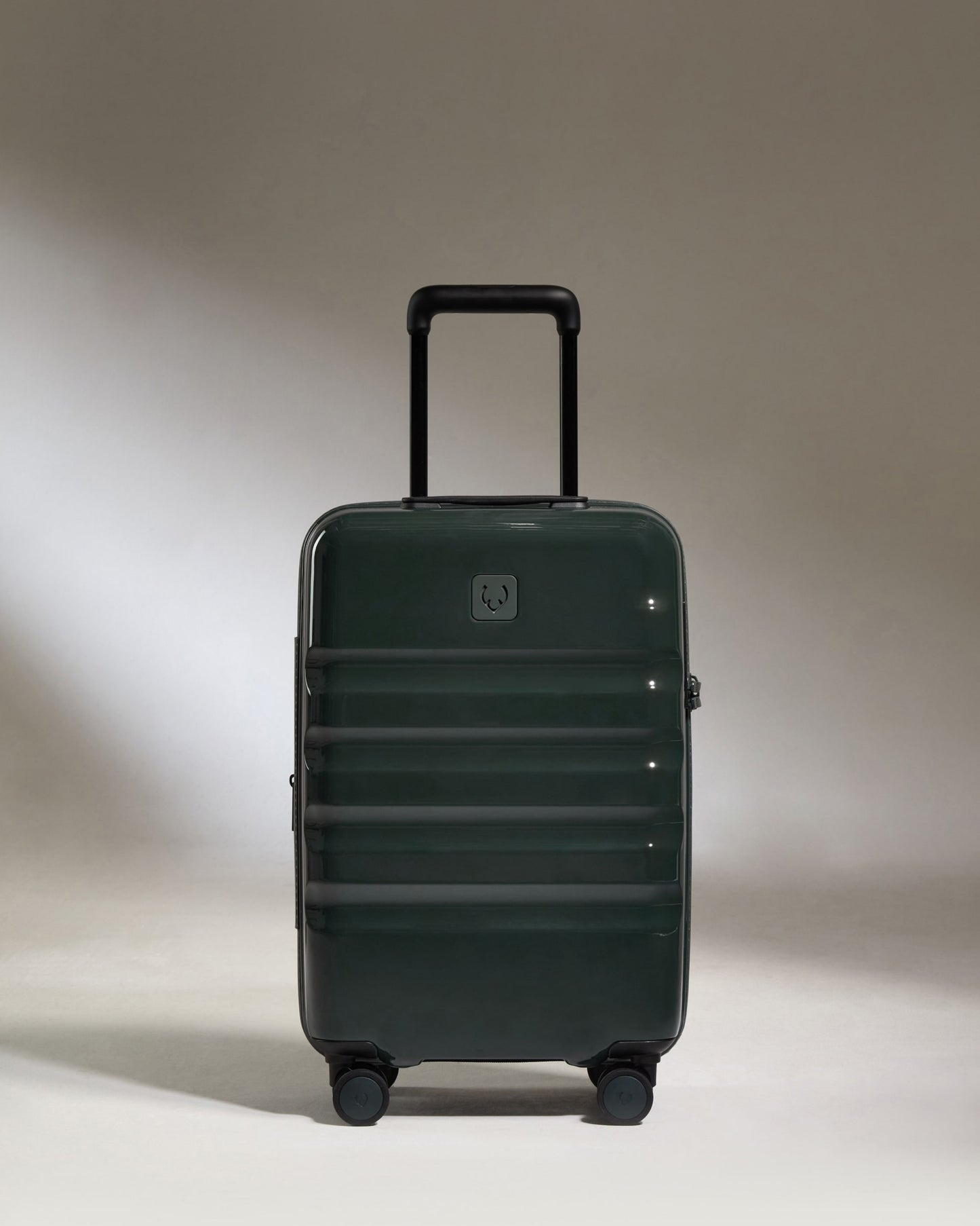 a green suitcase with wheels