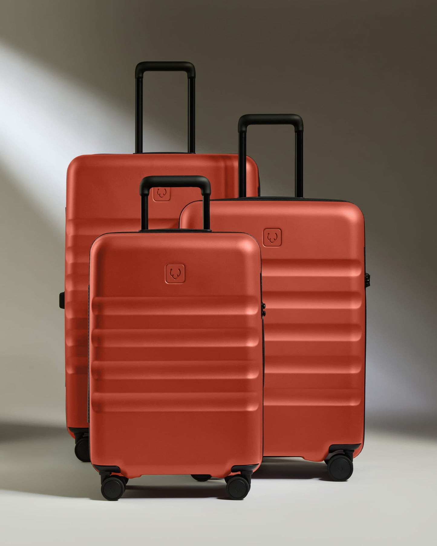 a group of luggage on wheels