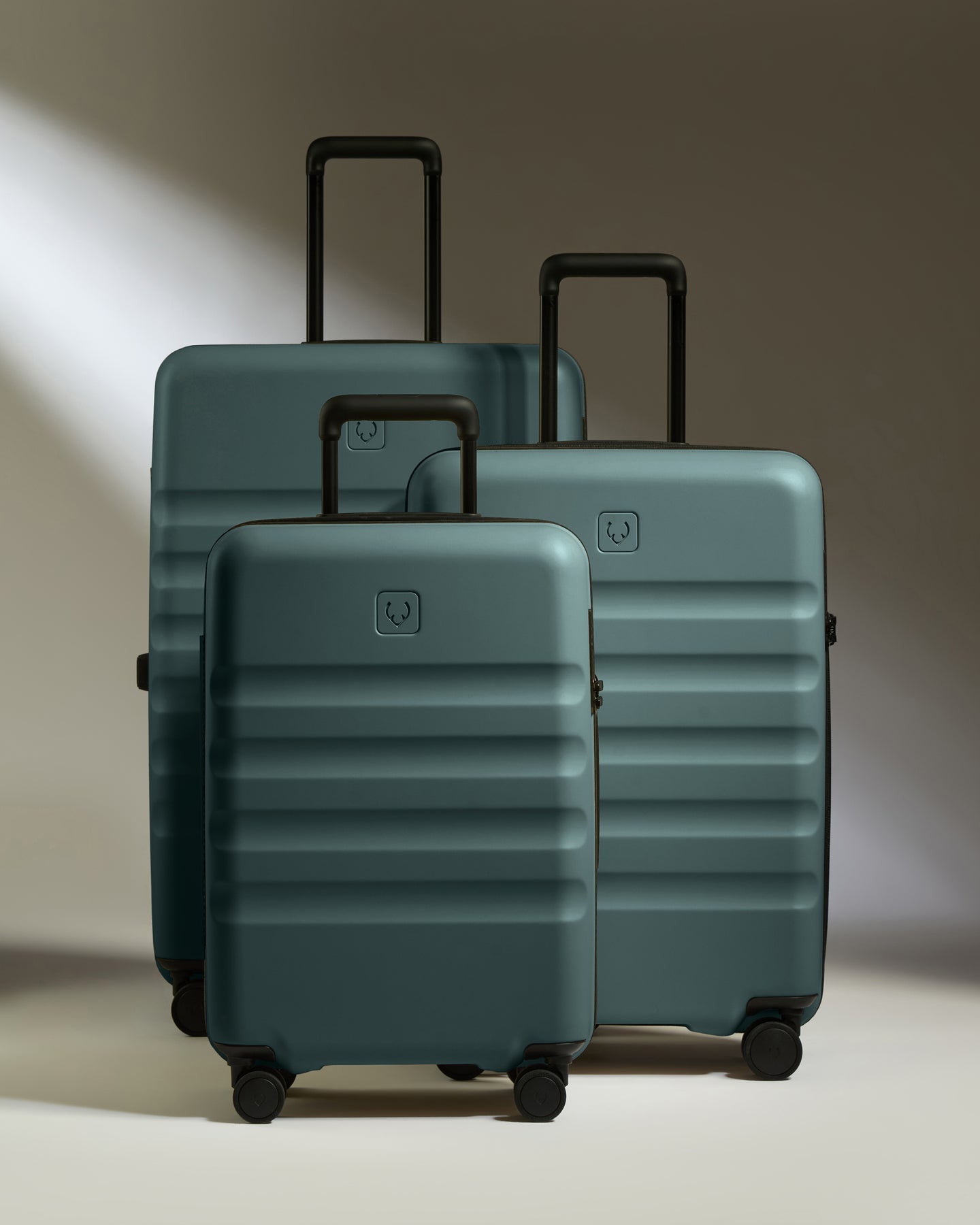 a group of luggage on wheels