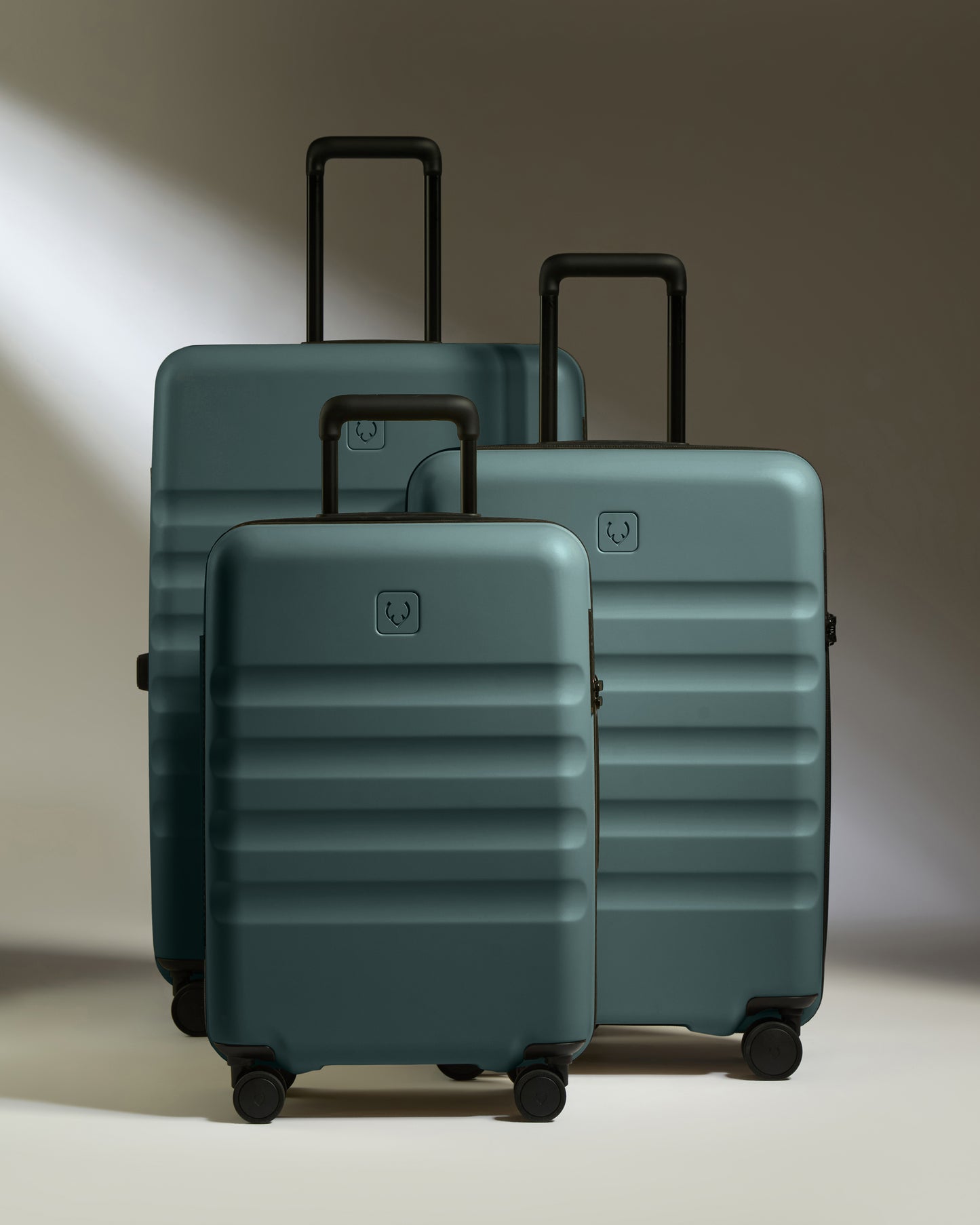 a group of luggage on wheels