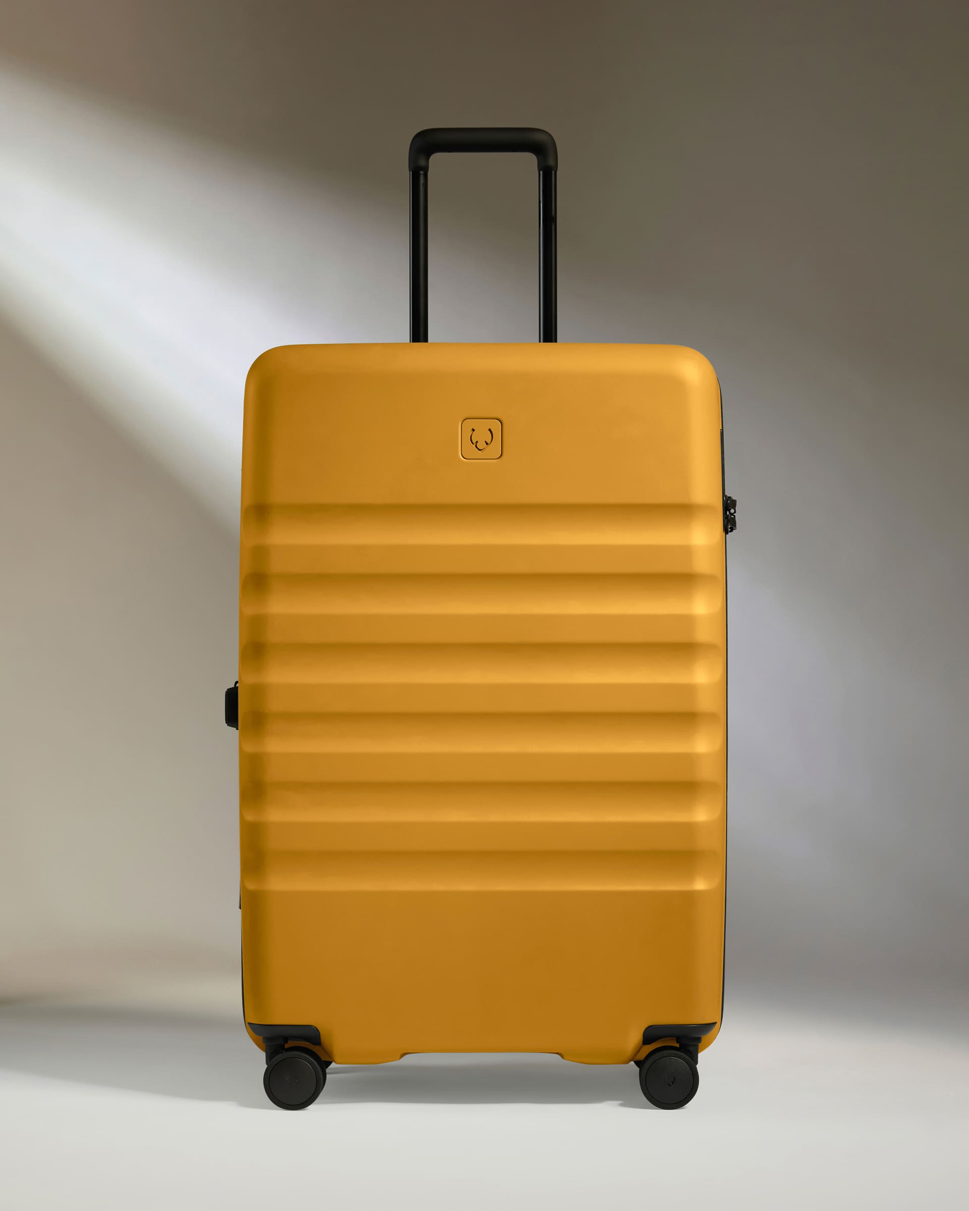 a yellow suitcase with wheels