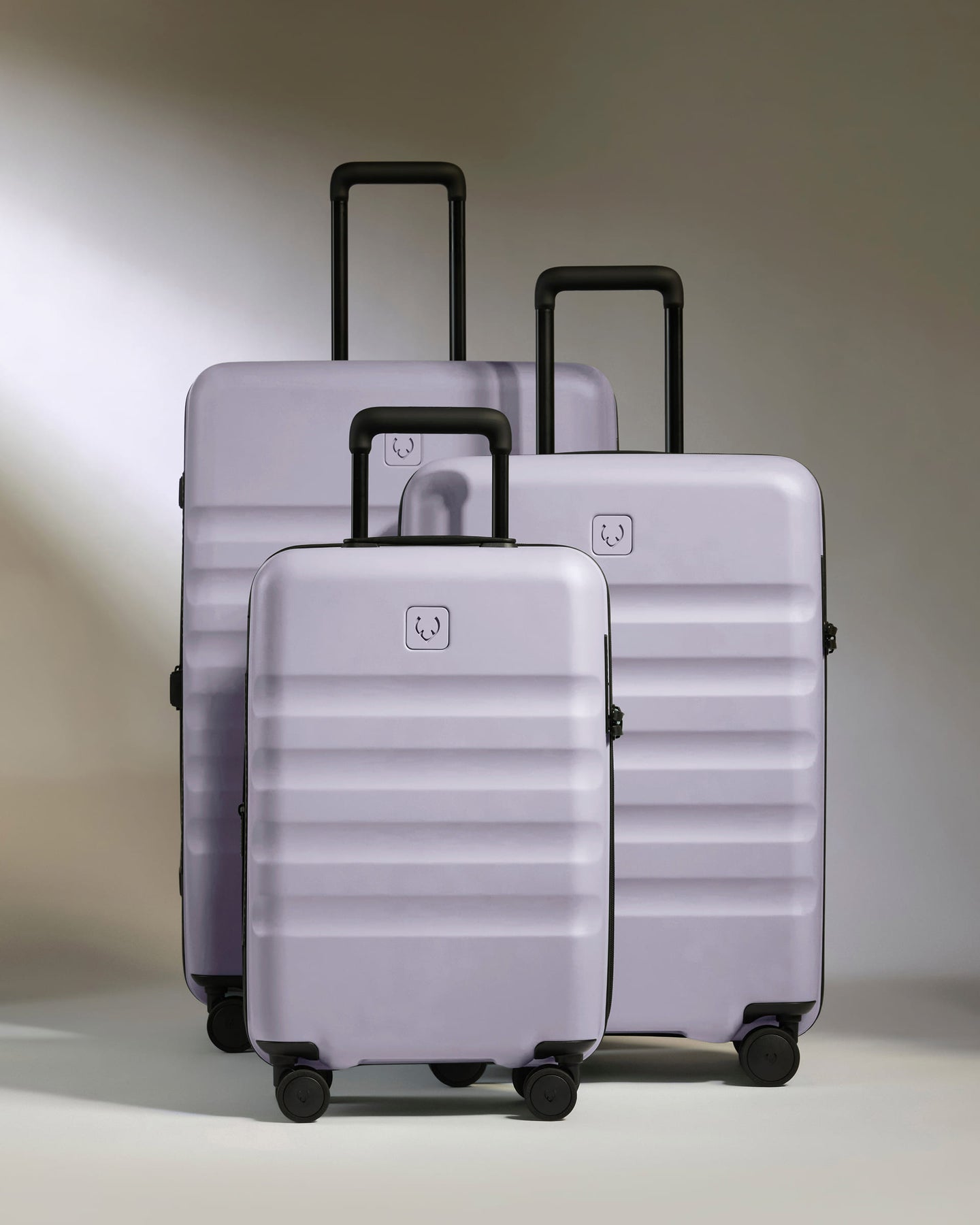 a group of luggage on wheels