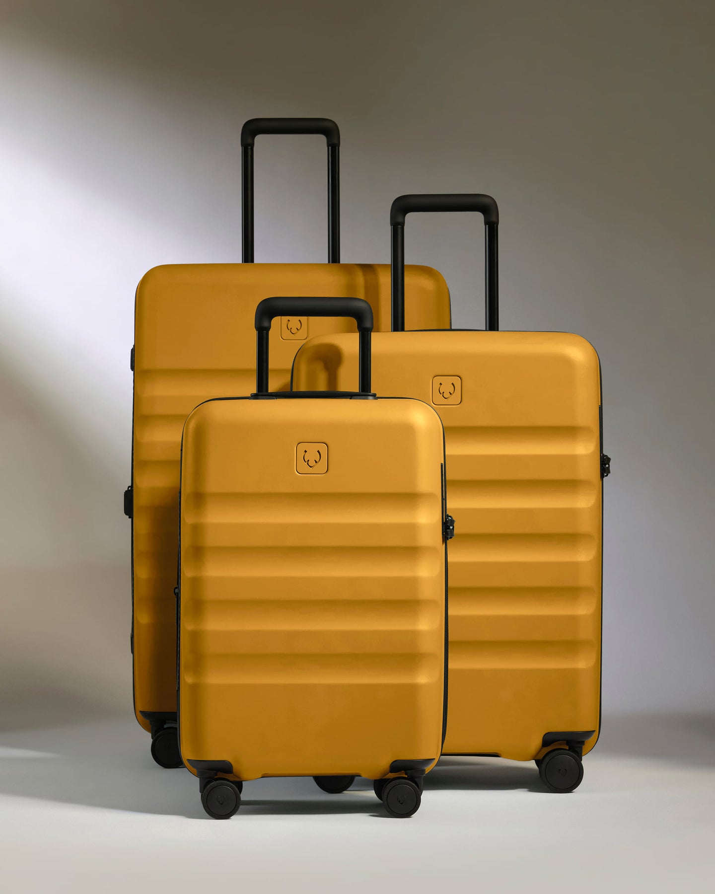 a group of luggage on wheels