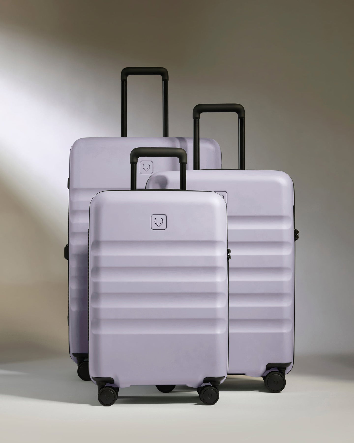 a group of luggage on wheels