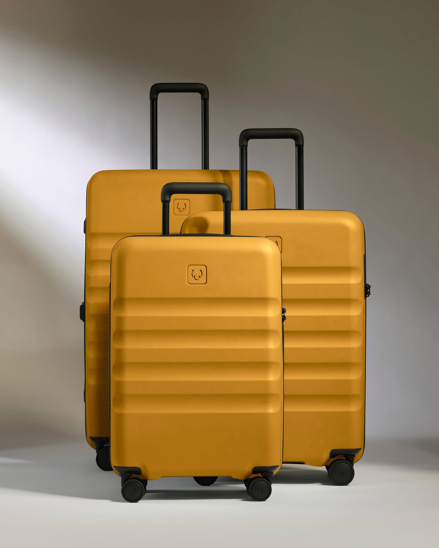 a group of luggage on wheels