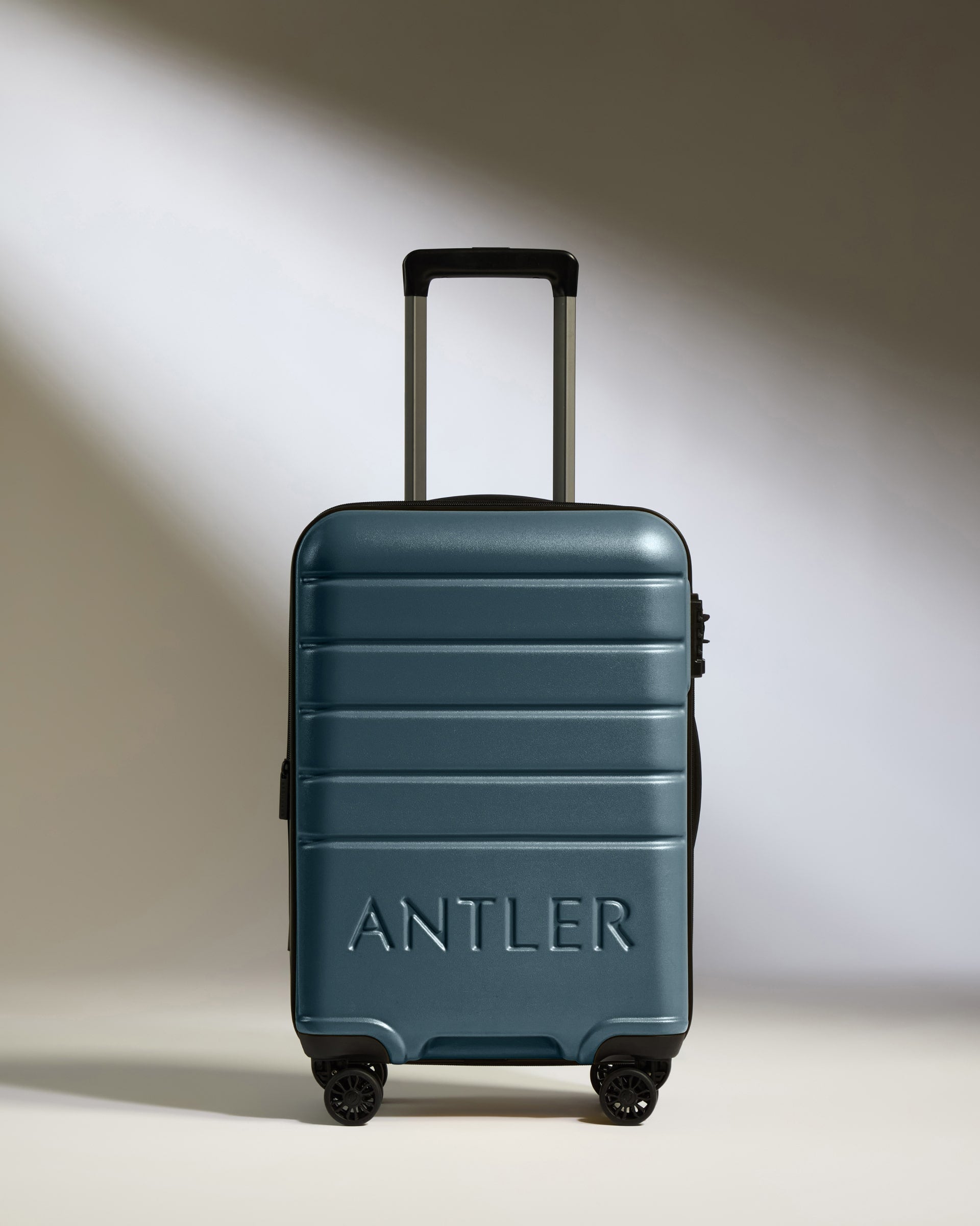 a blue suitcase with wheels
