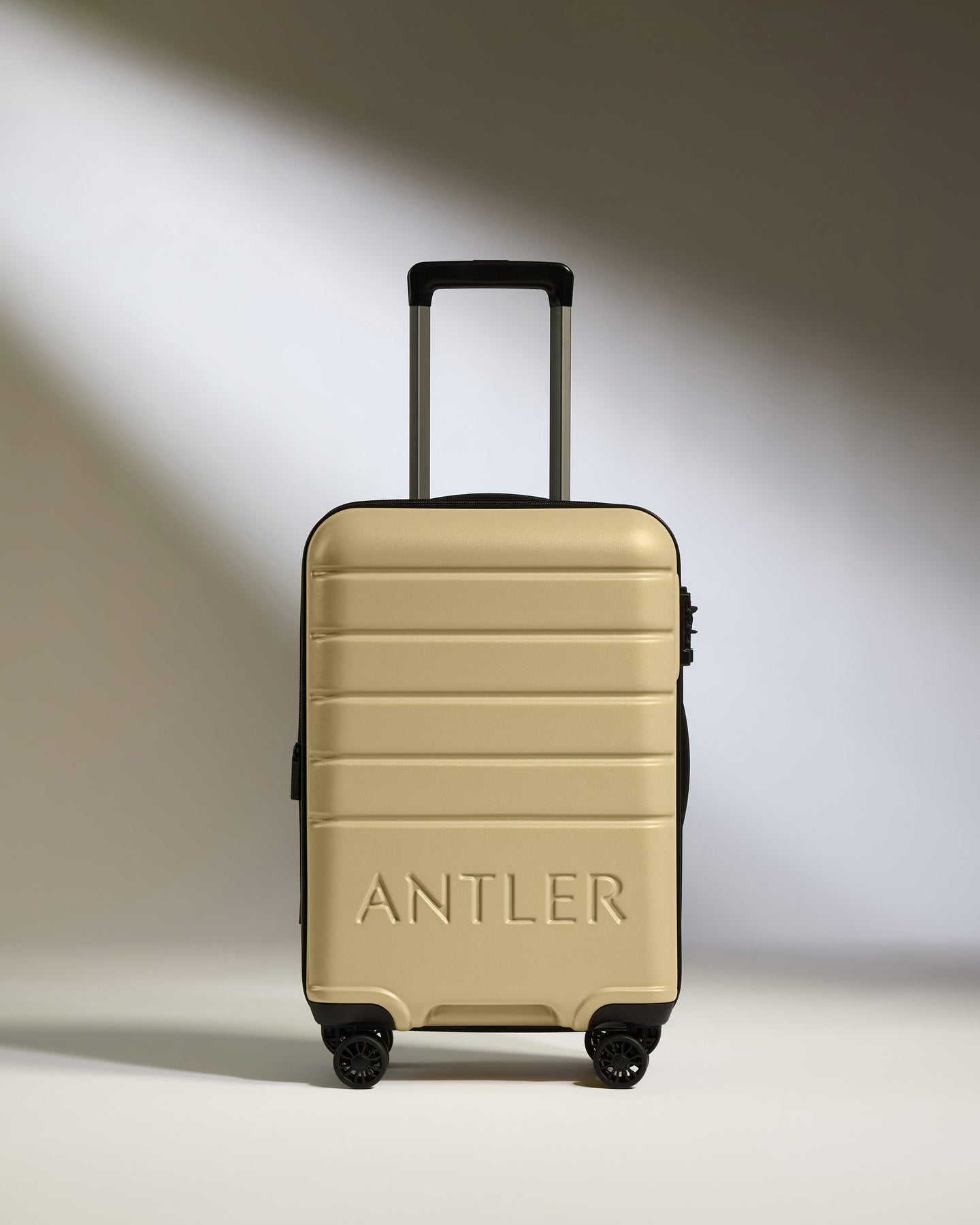 Expandable Carry-On Luggage in Dark Sand - Logo