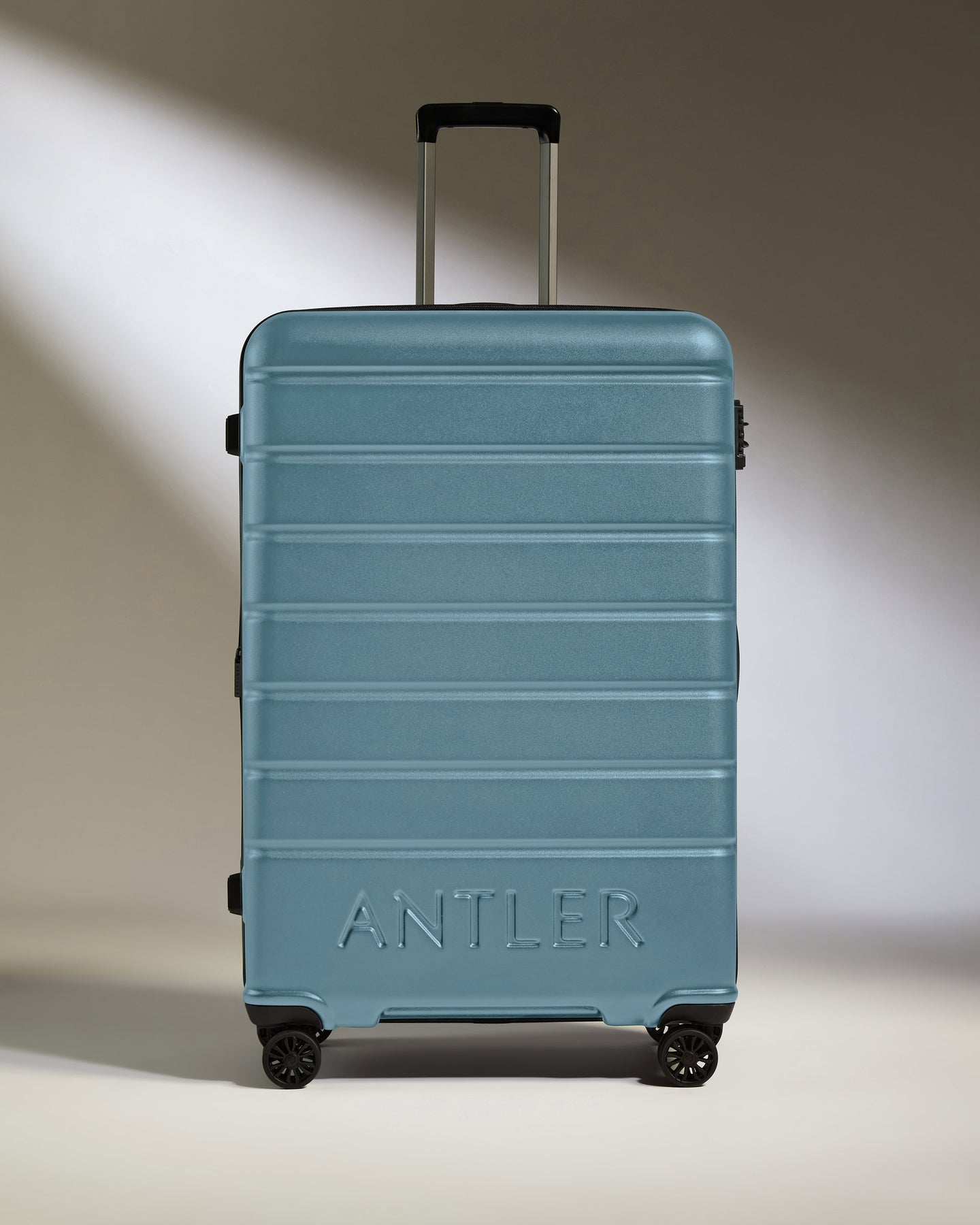 Large Luggage in Light Blue - Logo