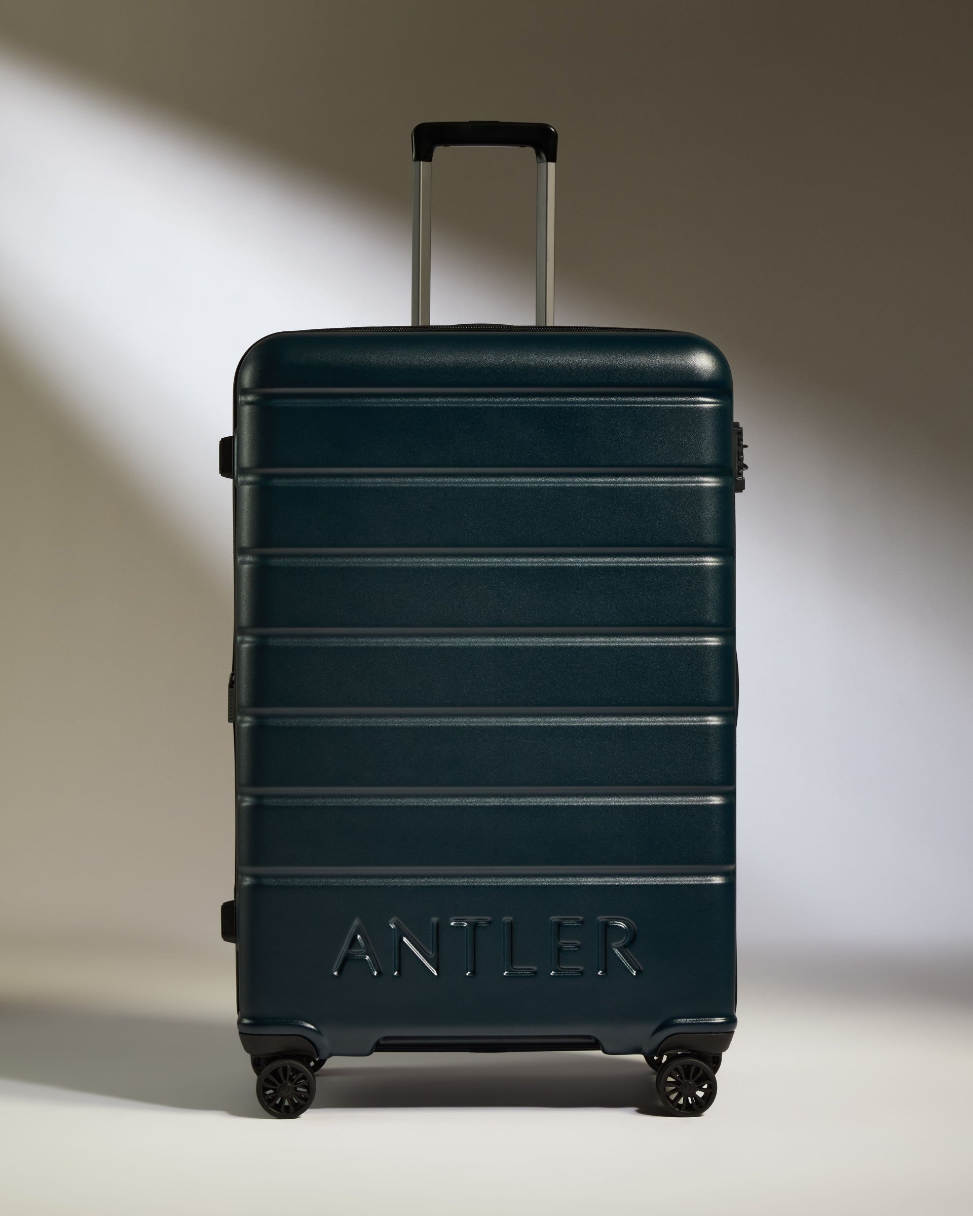a suitcase with wheels and handle