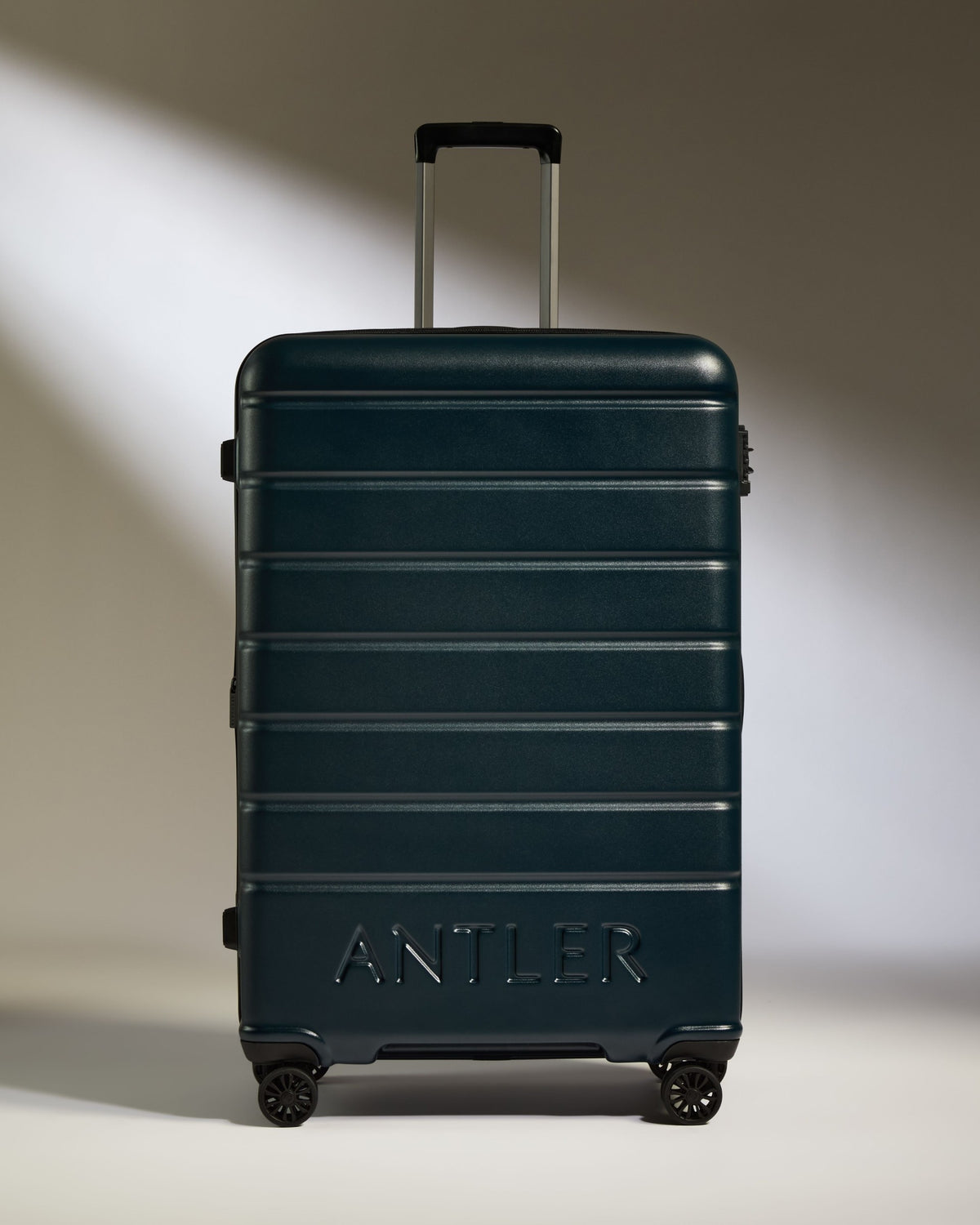 a suitcase with wheels and handle