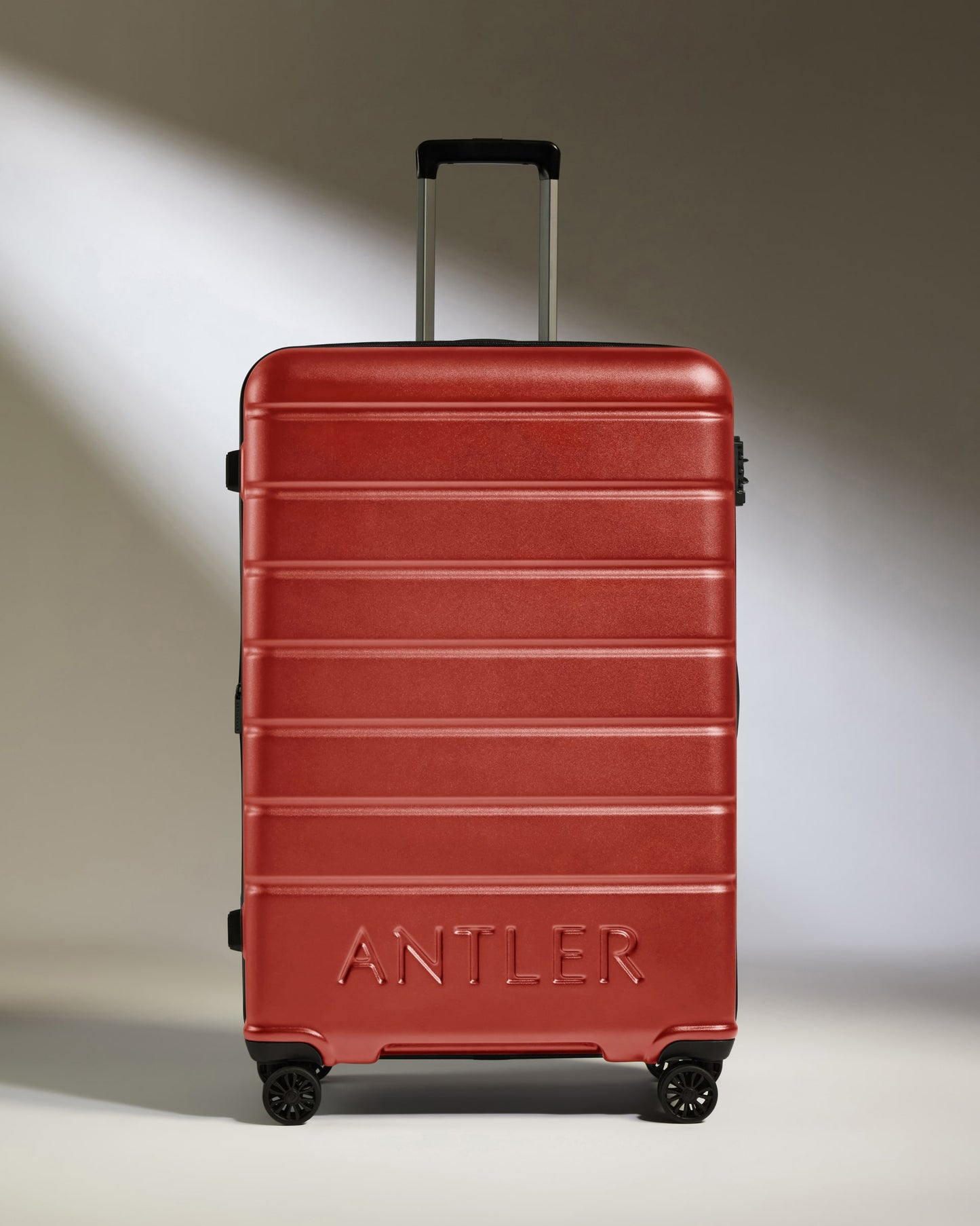 Large Luggage in Red Orange - Logo