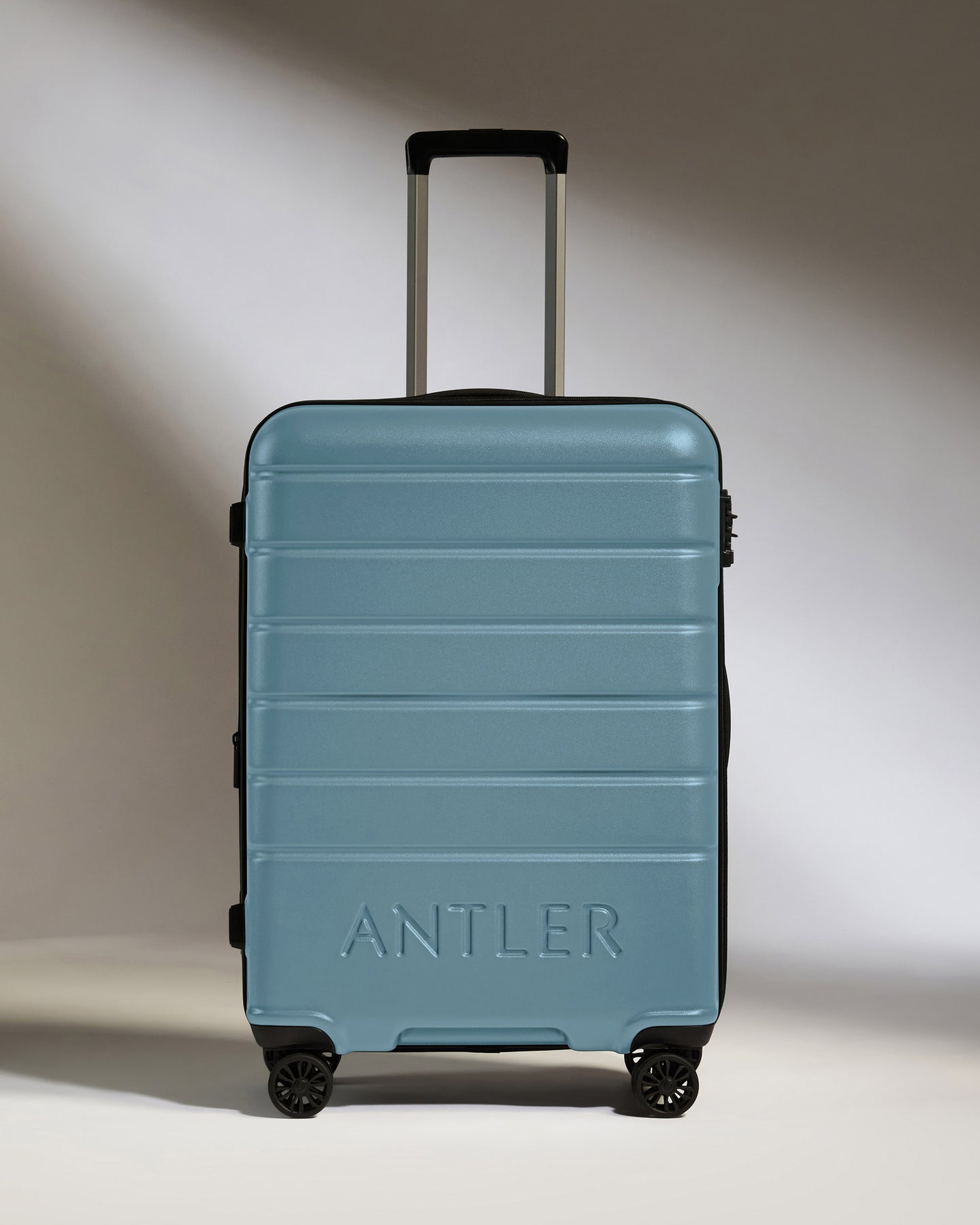 Medium Luggage in Light Blue - Logo
