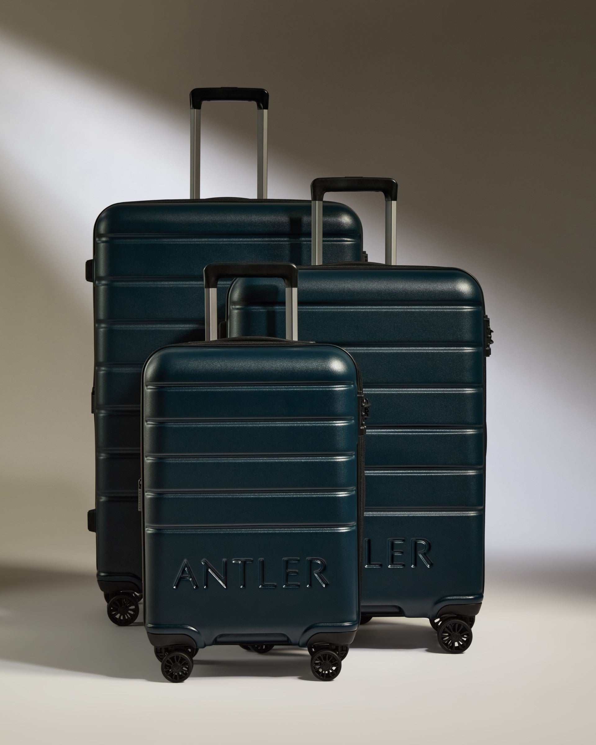 a group of luggage on wheels
