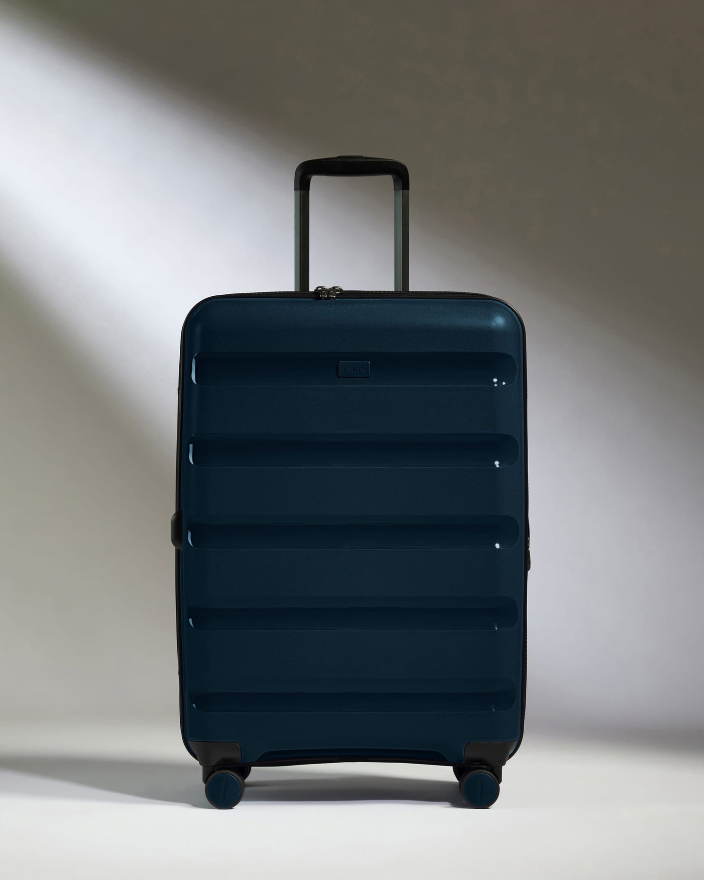 Medium Luggage in Midnight Blue - Logo Stripe