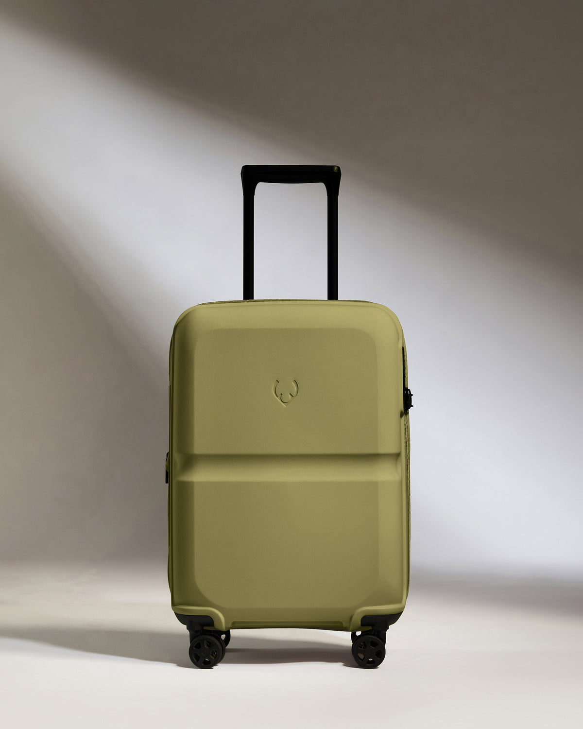 a green suitcase with wheels
