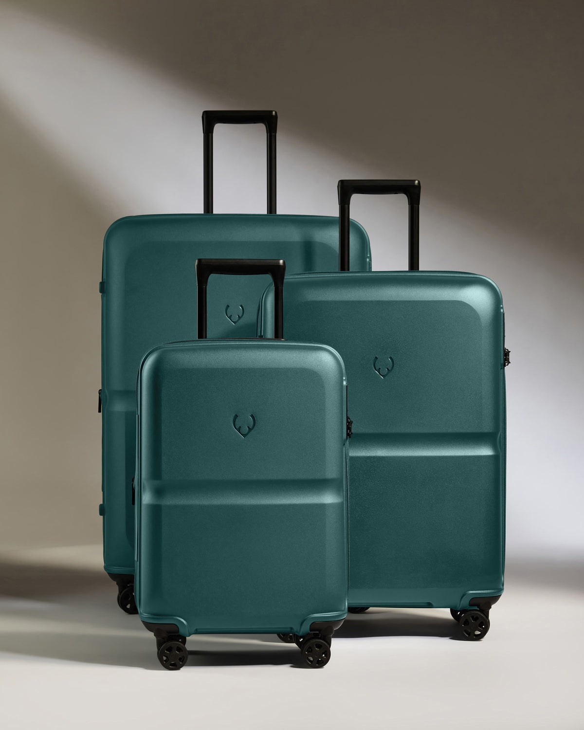 a group of luggage on wheels