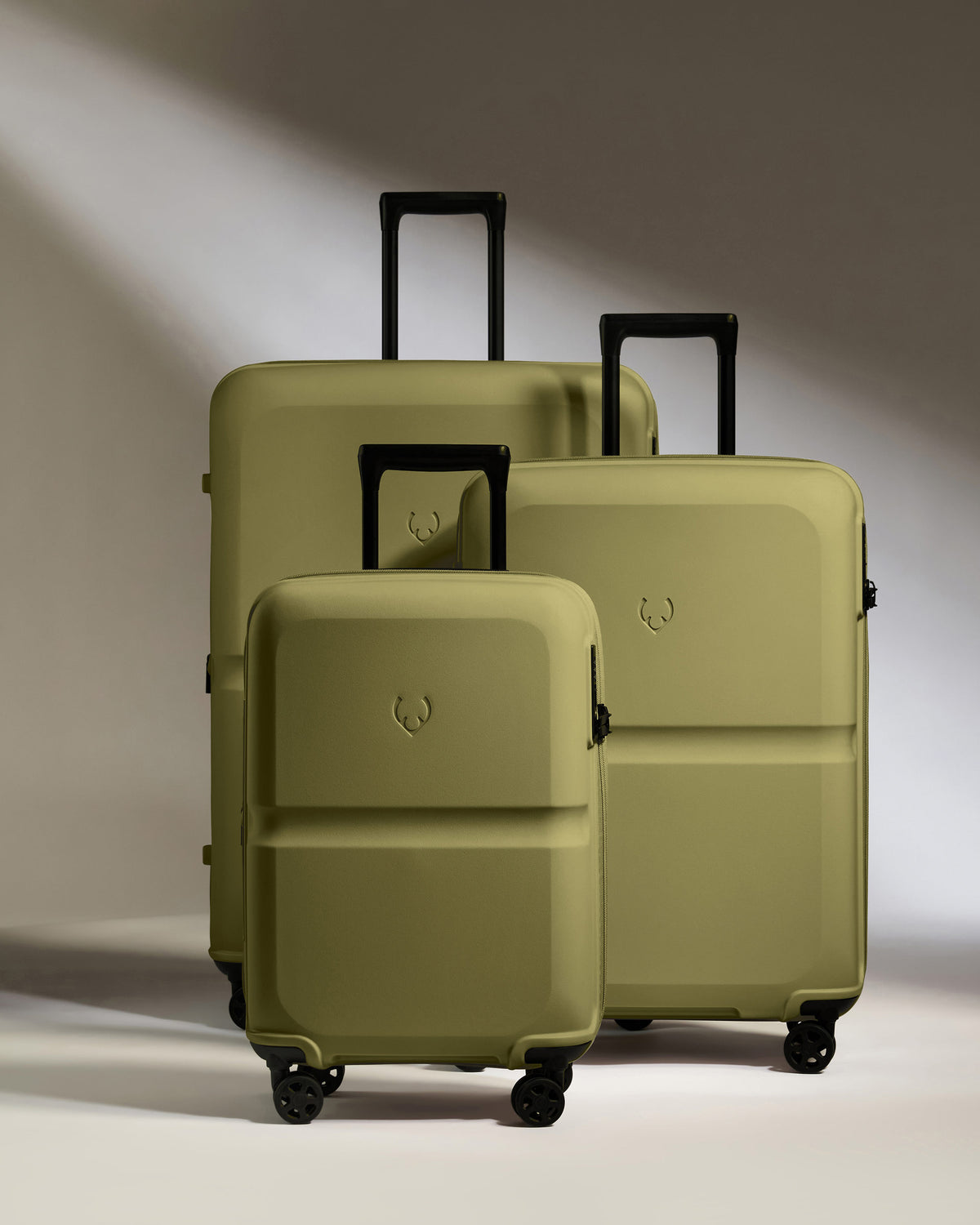 a group of luggage on wheels