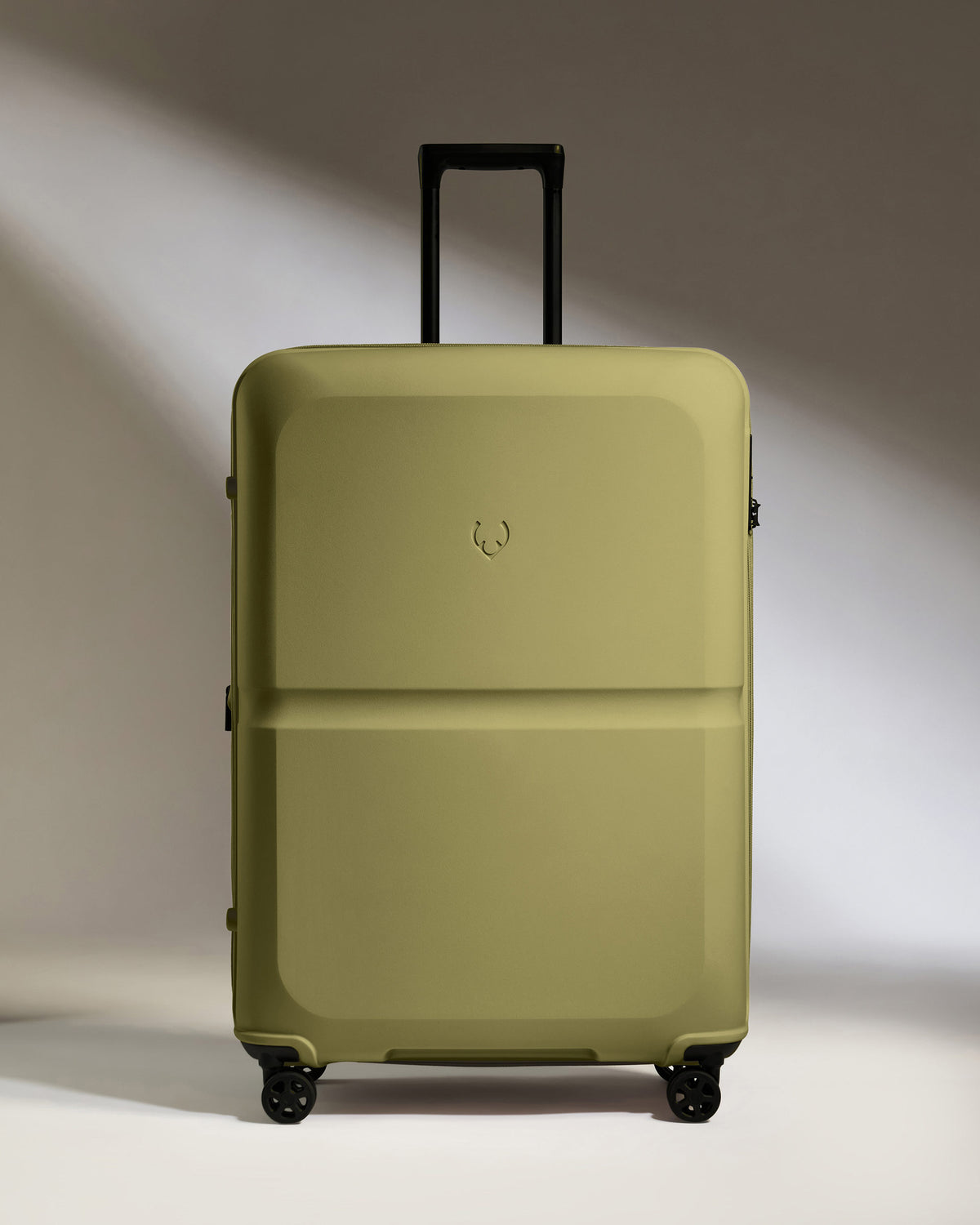 a green suitcase with wheels