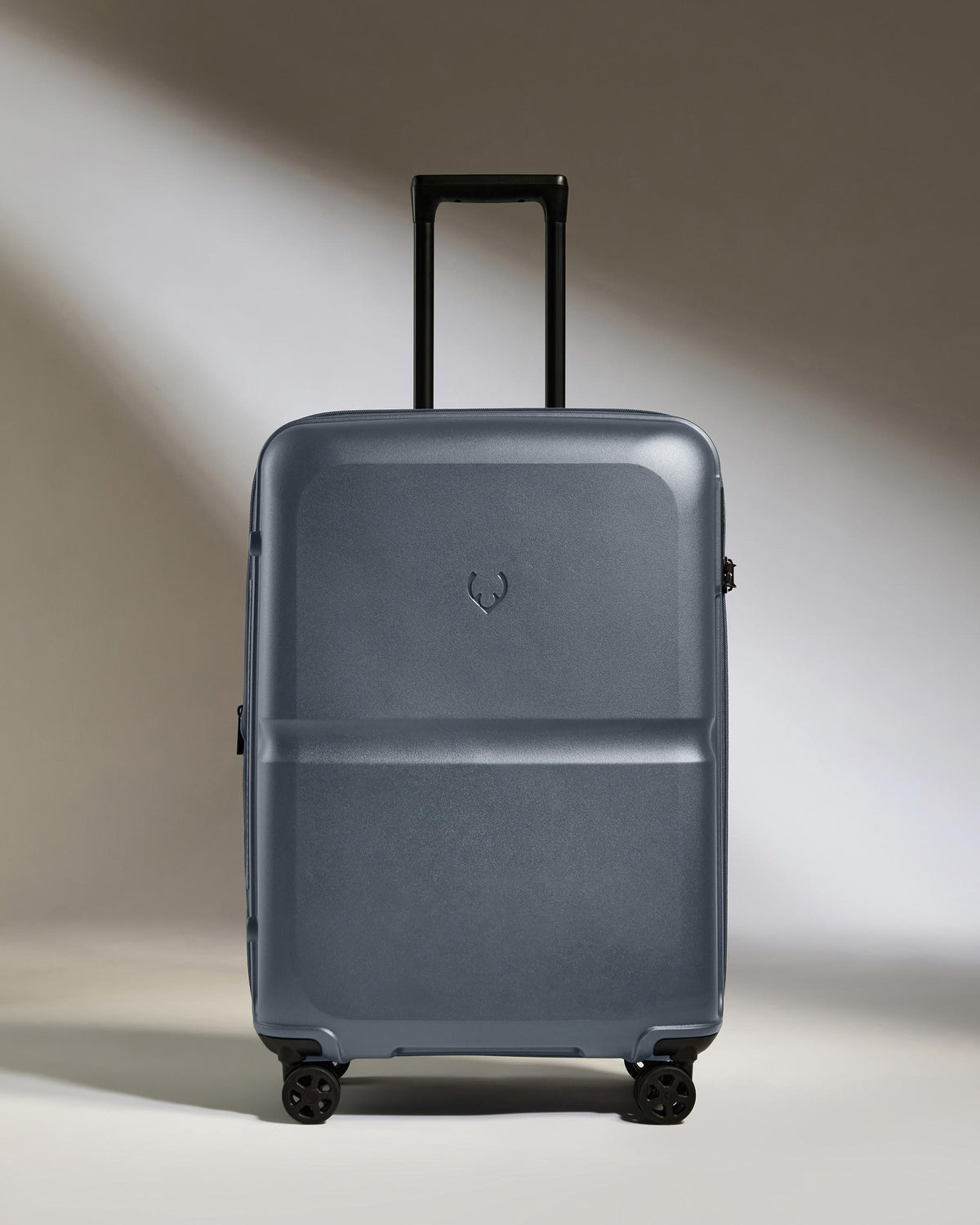 a grey suitcase with wheels