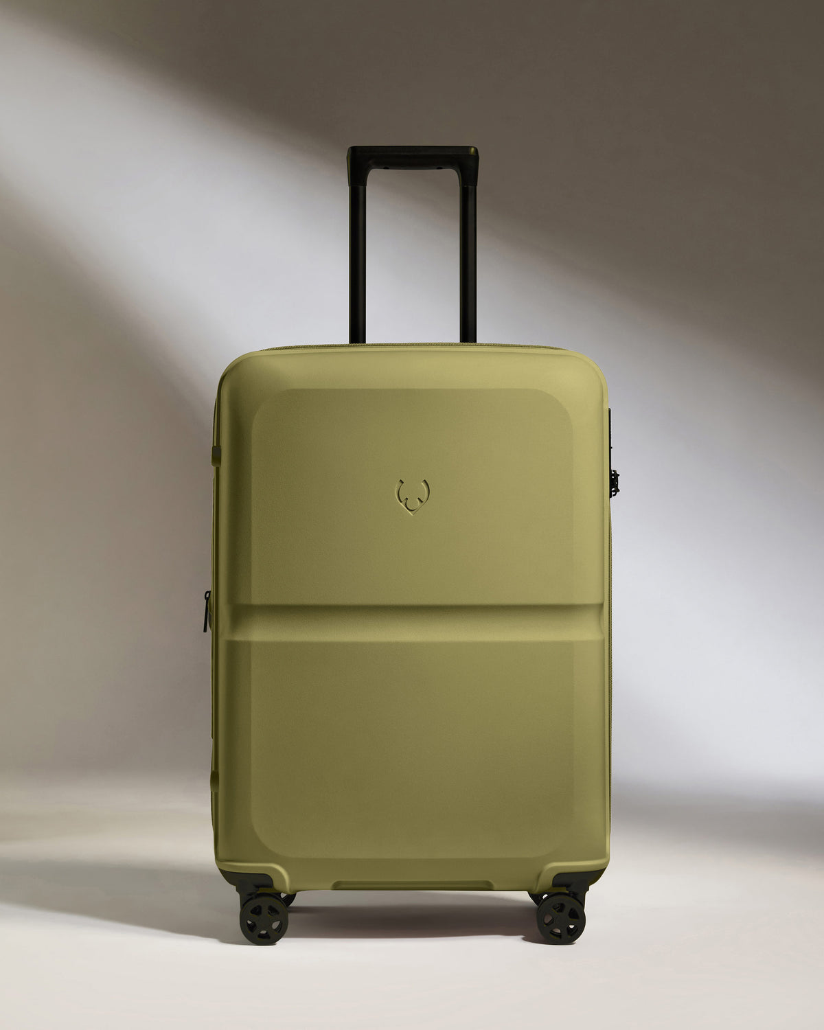 a green suitcase with black wheels
