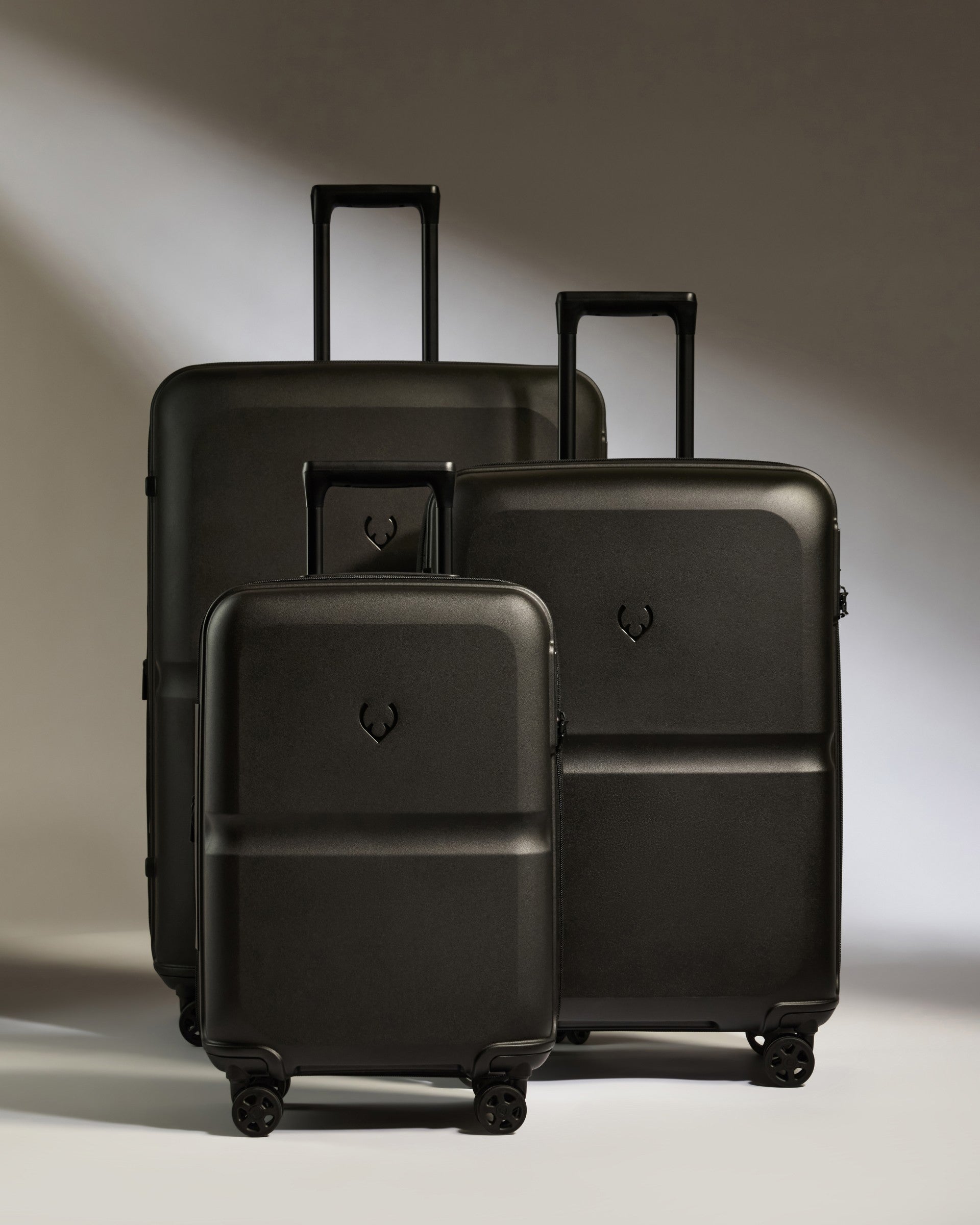 a group of black luggage
