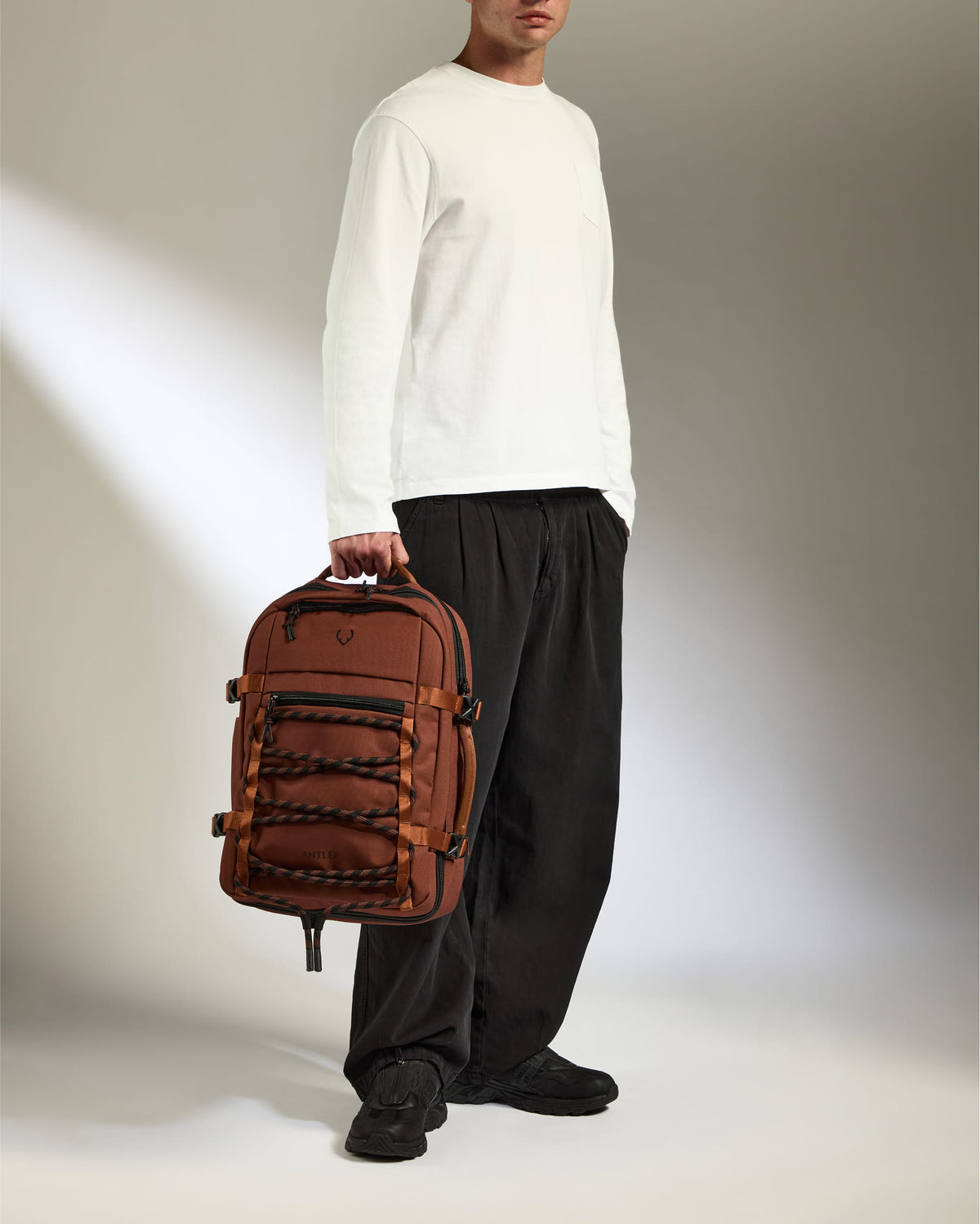 a man holding a backpack
