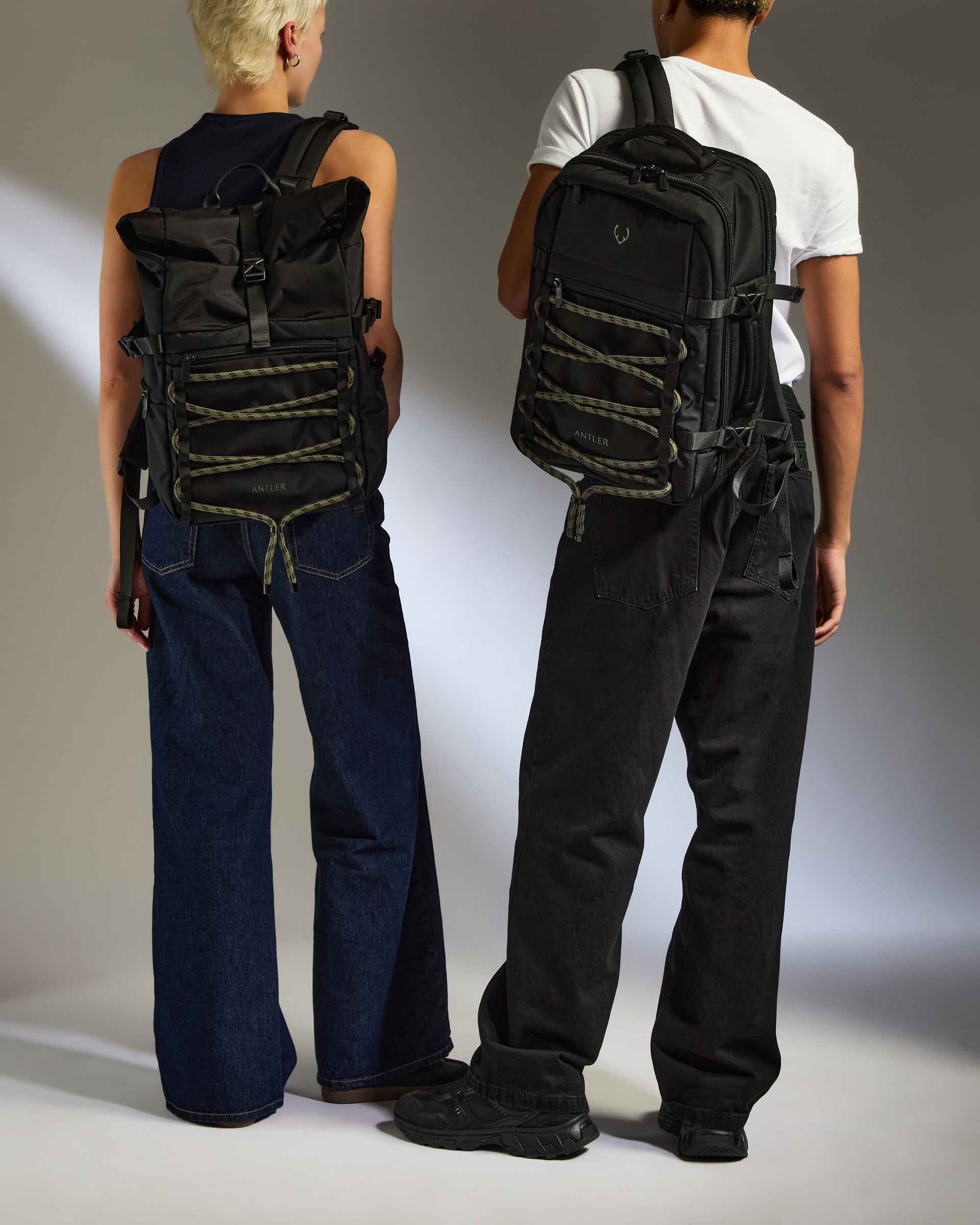 two men wearing backpacks