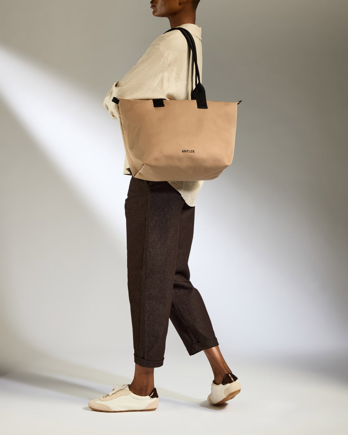 a woman carrying a bag