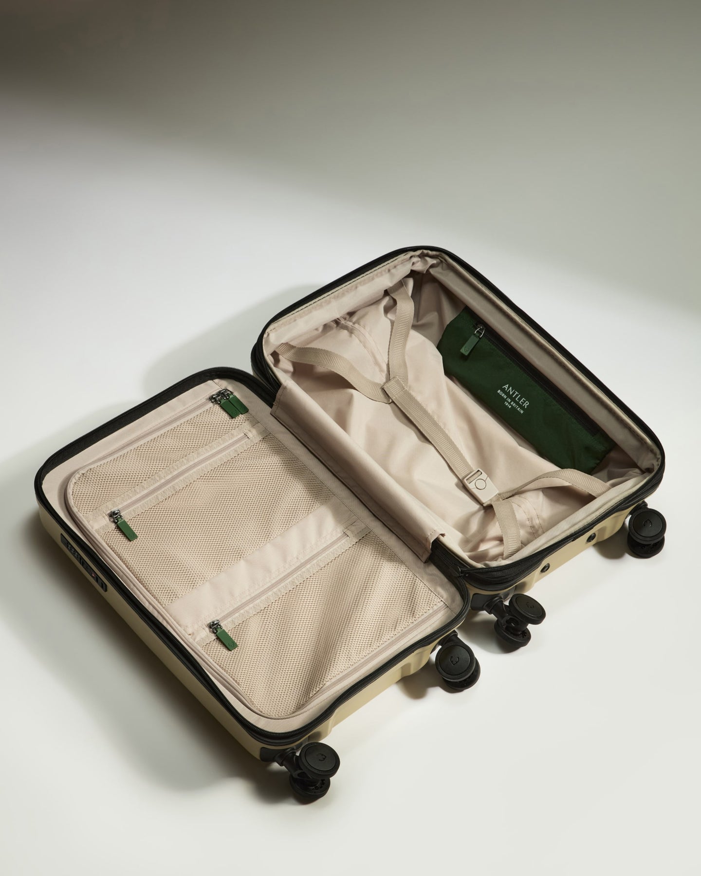 a suitcase with wheels and a cloth inside