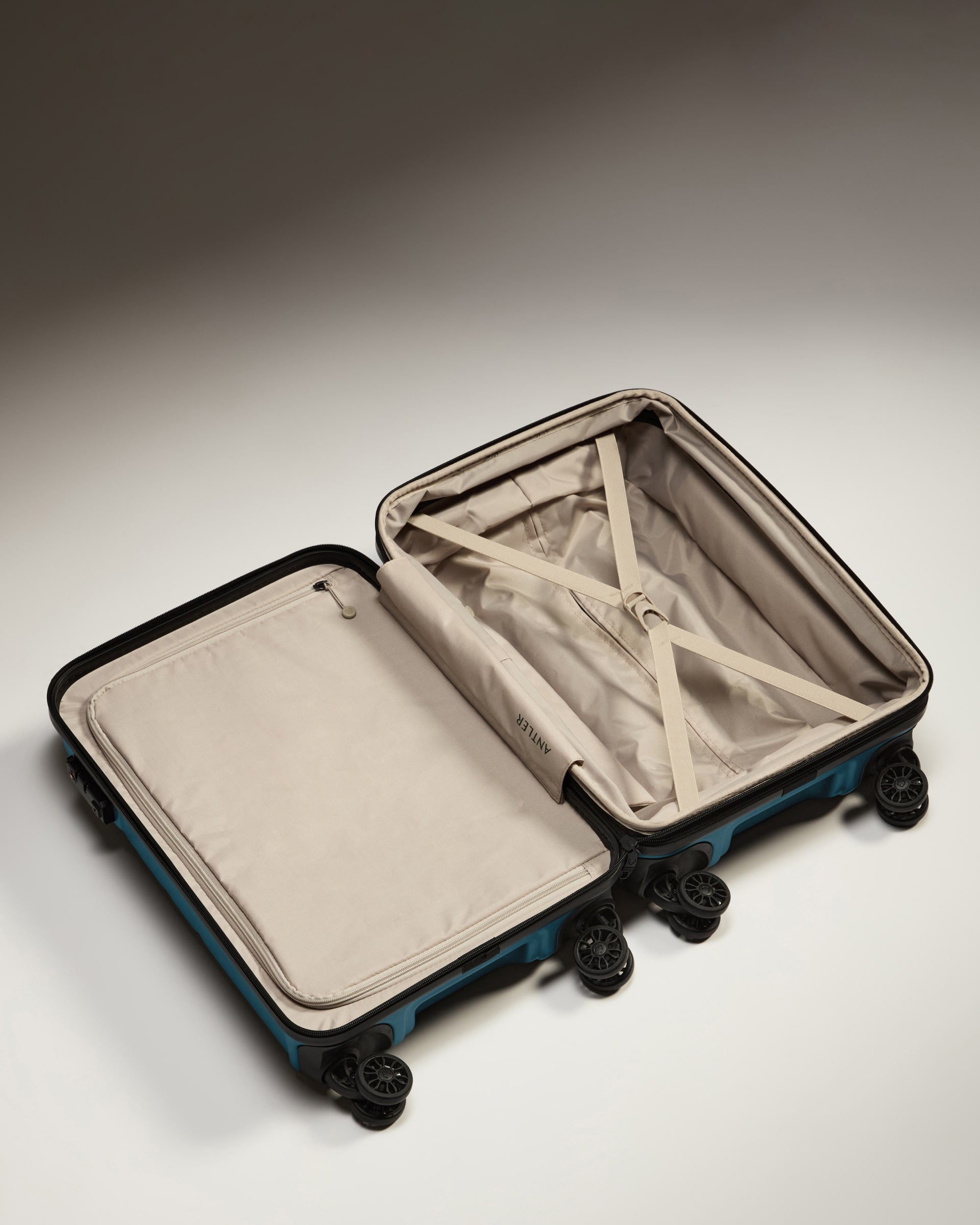 a suitcase with wheels and a lid