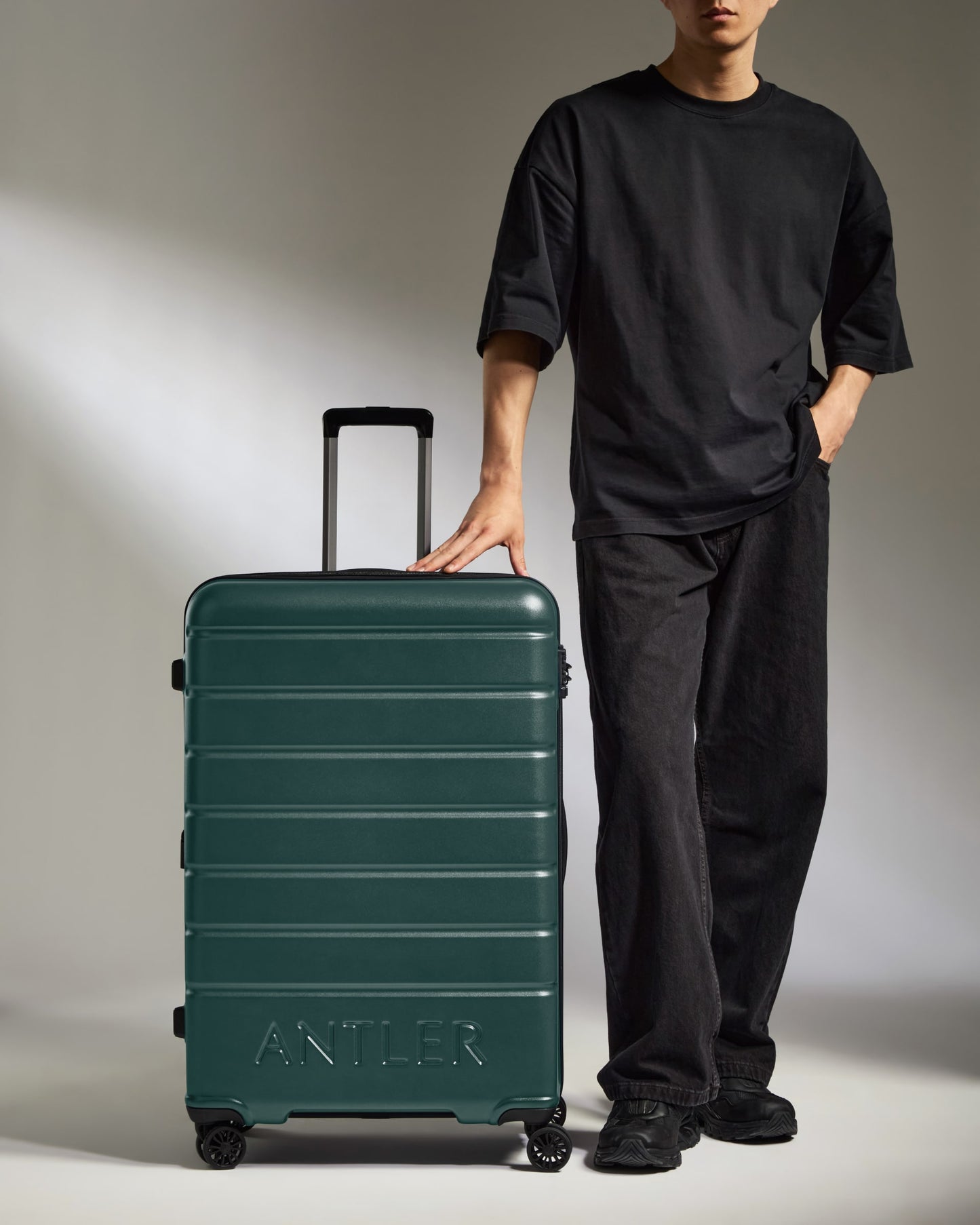 Large Luggage in Dark Teal - Logo
