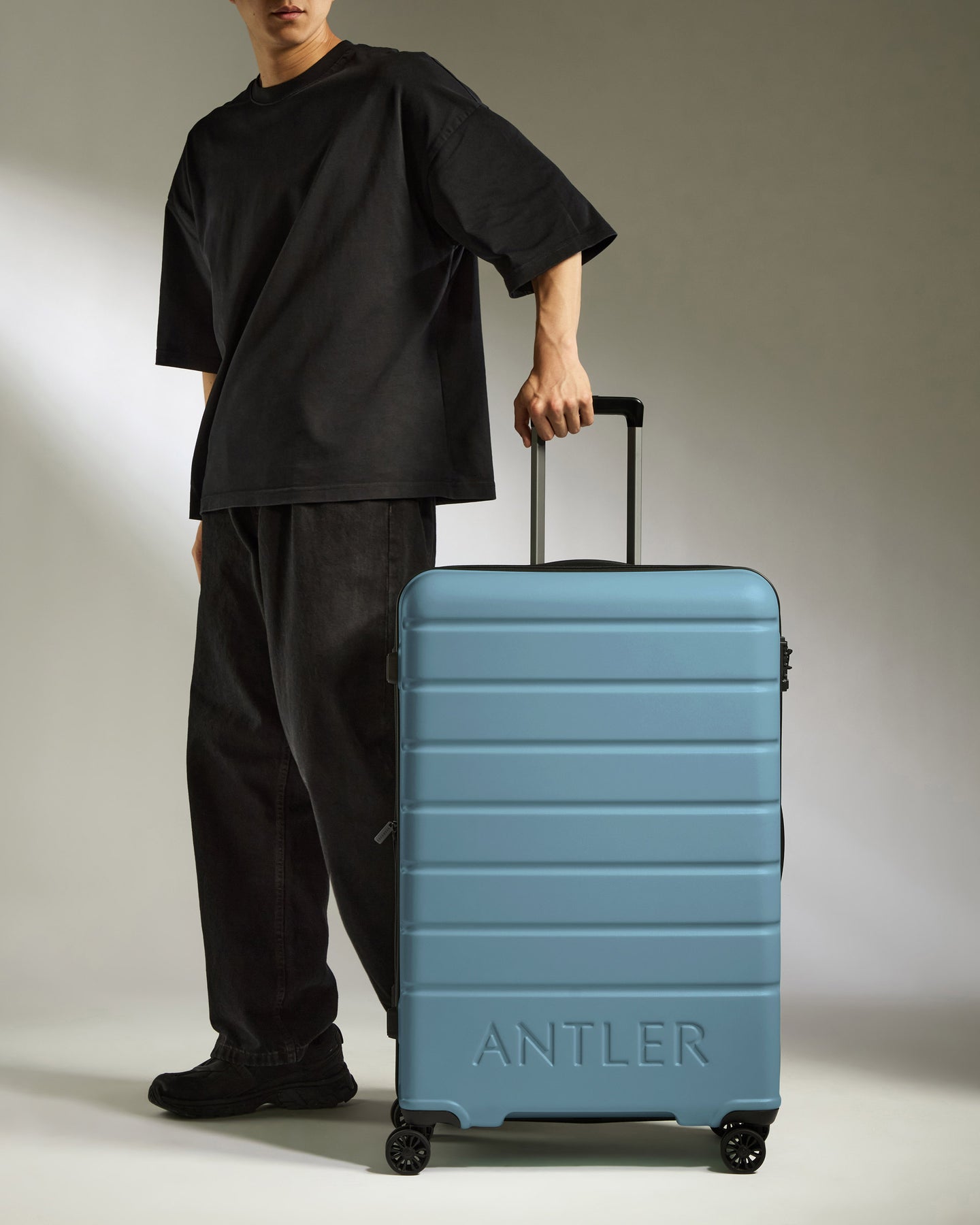 Large Luggage in Light Blue - Logo