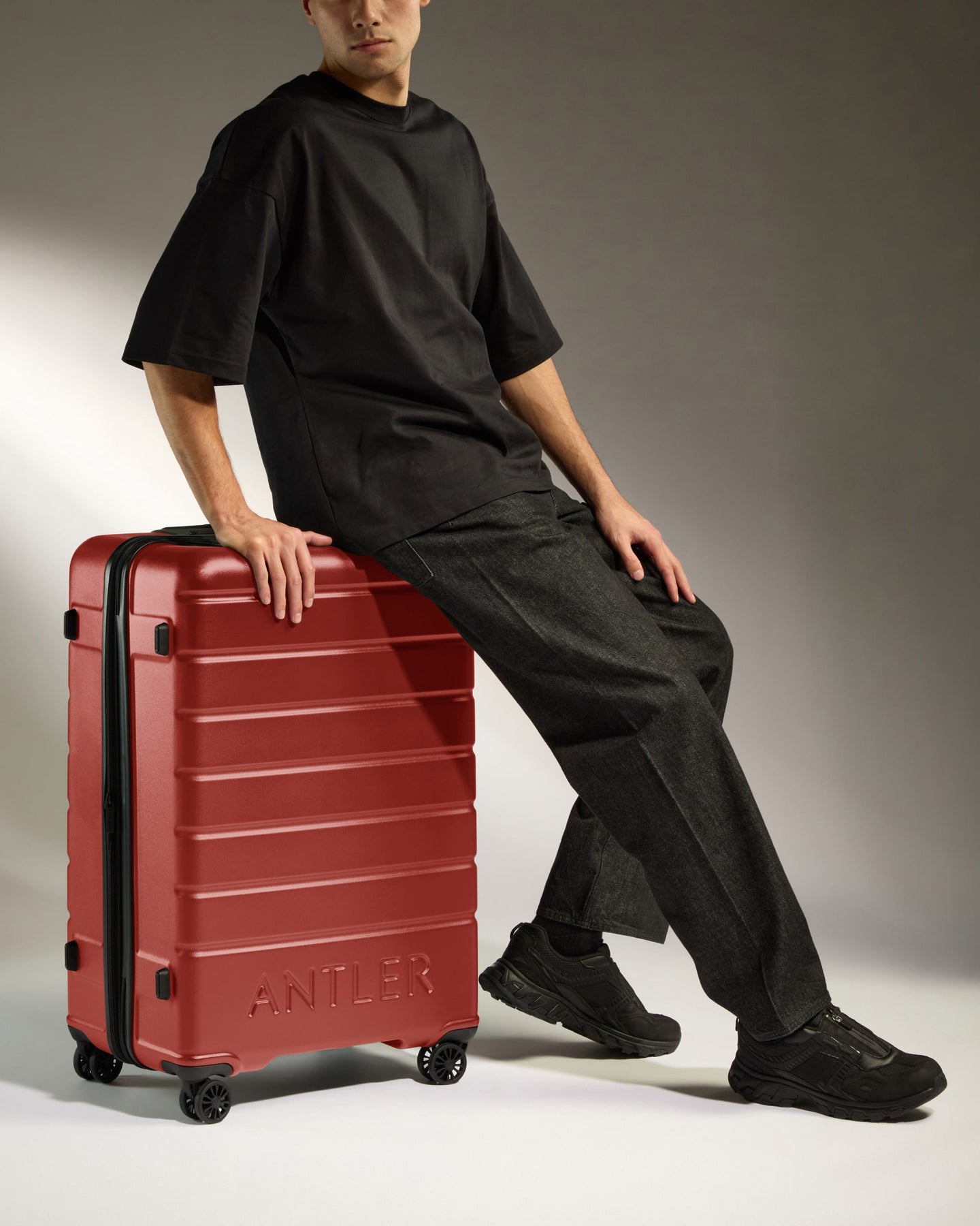 Large Luggage in Red Orange - Logo